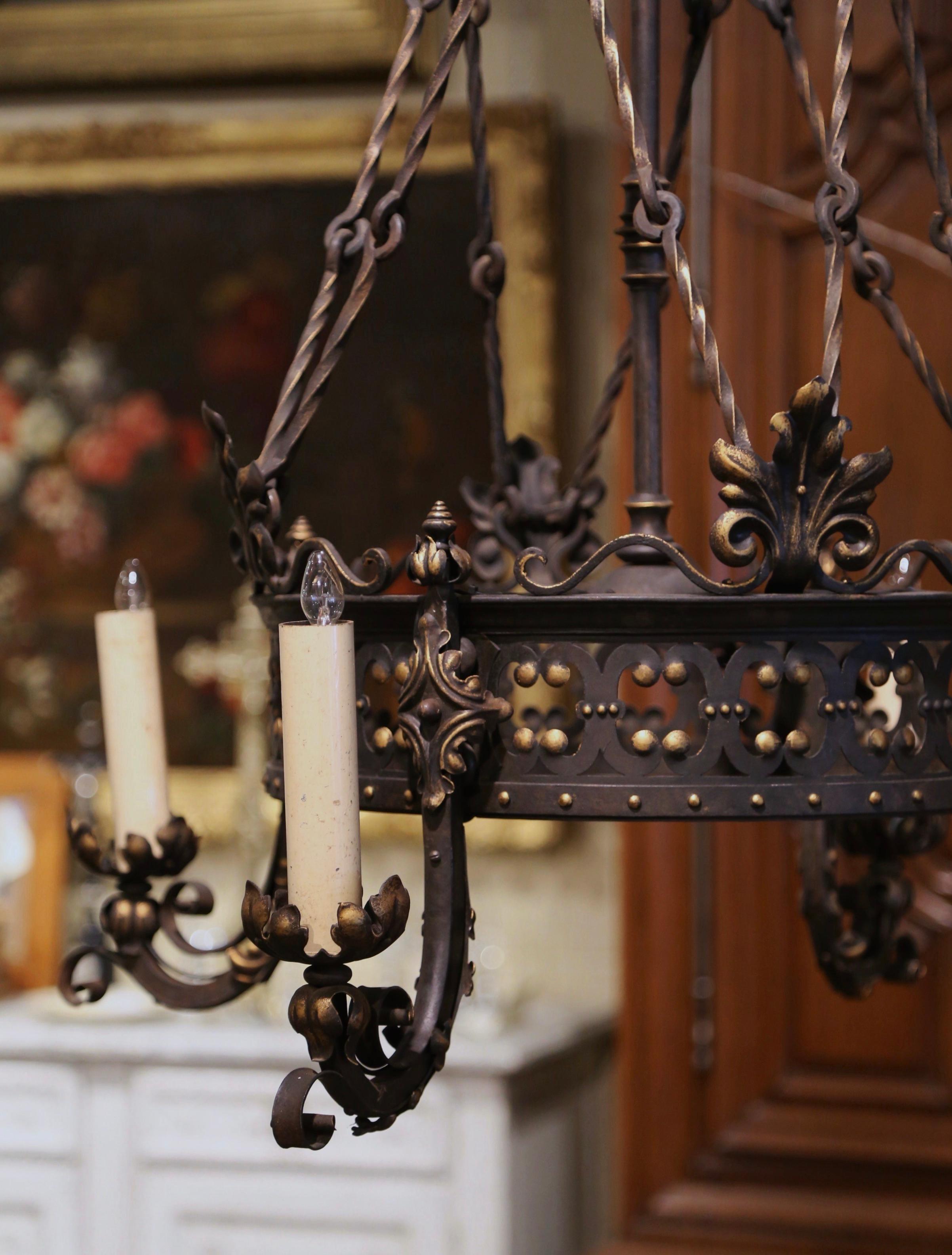 Patinated 19th Century French Gothic Black and Gilt Wrought Iron Four-Light Chandelier For Sale