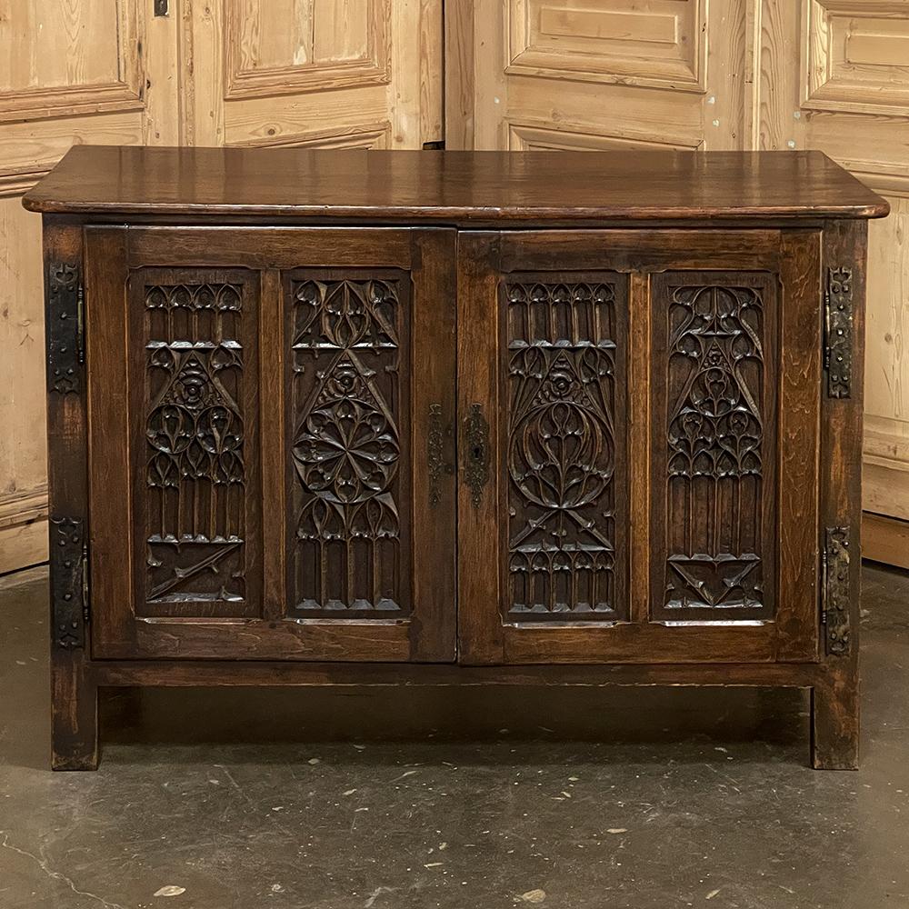 19th Century French Gothic Credenza is a remarkable work of the cabinet maker's art, featuring tailored architecture melded with the timeless intricacies of the style that dates back to the 12th century in France! Solid planks of oak were used