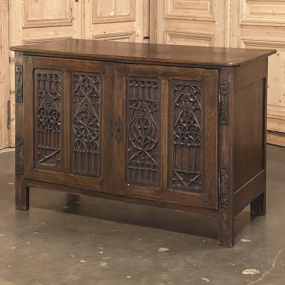 19th Century French Gothic Credenza is a remarkable work of the cabinet maker's art, featuring tailored architecture melded with the timeless intricacies of the style that dates back to the 12th century in France!  Solid planks of oak were used
