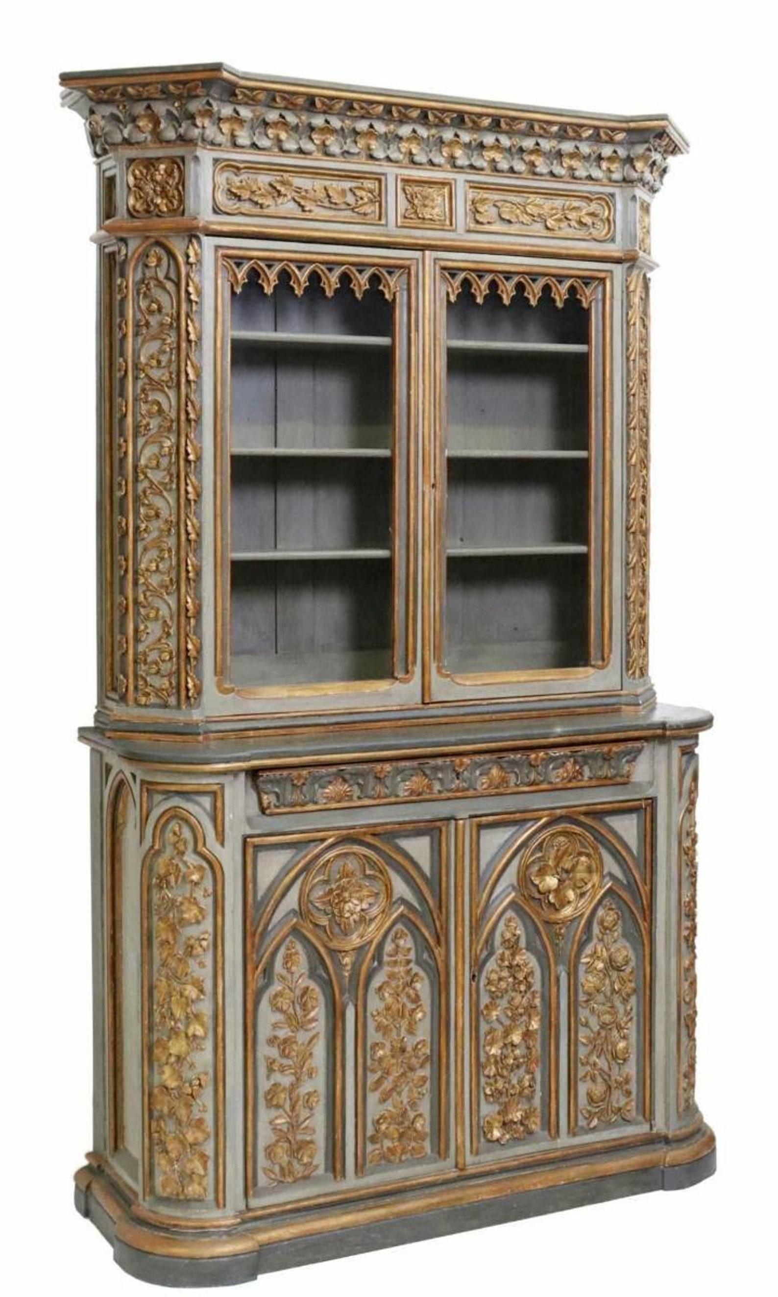 A magnificent 19th century Gothic Revival hand carved painted parcel gilt bibliothèque (bookcase - buffet - china cabinet). 

Born in France, circa 1840, most impressive size, two-piece, high quality solid wood construction, ornate Neo-Gothic