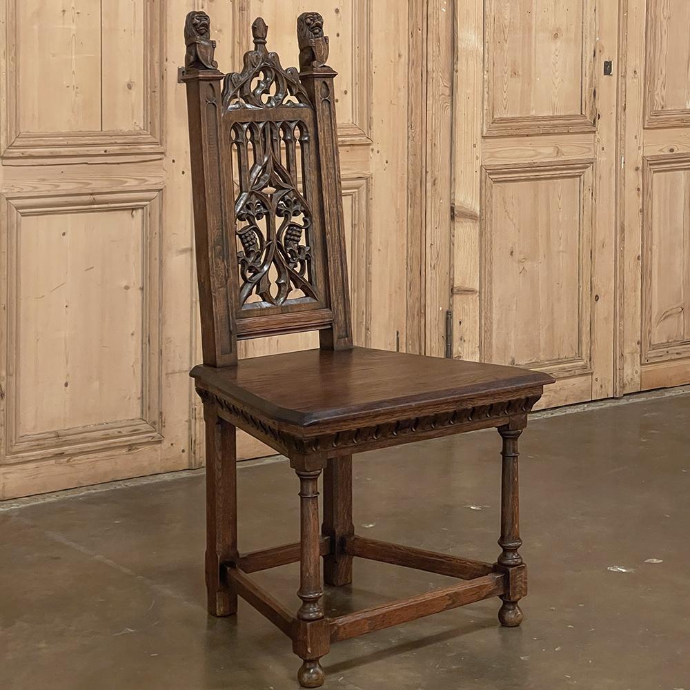 19th Century French Gothic Revival chair is a wonderful testament to the craftsmen of a bygone era! Hand-sculpted from old growth oak, it features a trapezoidal seat which creates a shape great for anywhere in the room, especially the corner. The