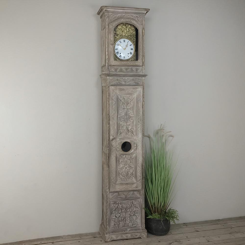 Found in Brittany, France, this amazing 19th century French Gothic stripped oak long case clock boasts incredible hand carved detail across its entire facade! Just an inch under eight feet tall, it boasts its original Morbier movement with an