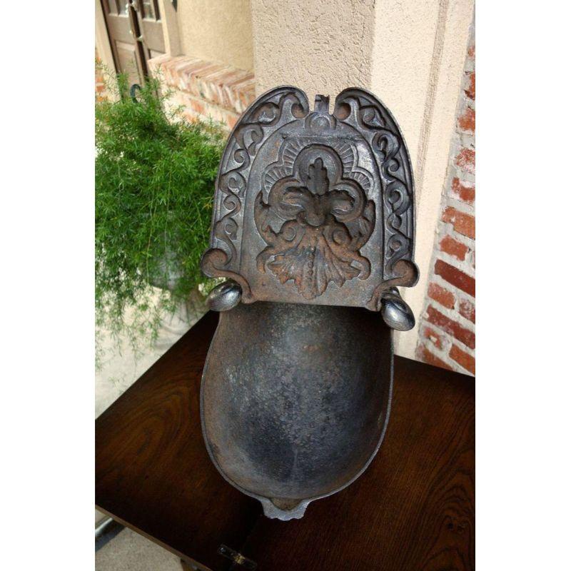 Direct from France, a heavy and substantial 19th century, French cast iron fireplace coal hod, in the shape commonly referred to as a “turtle” due to the shell shaped body and splayed legs. Unique and hard to find, perfect for a fireplace accent and