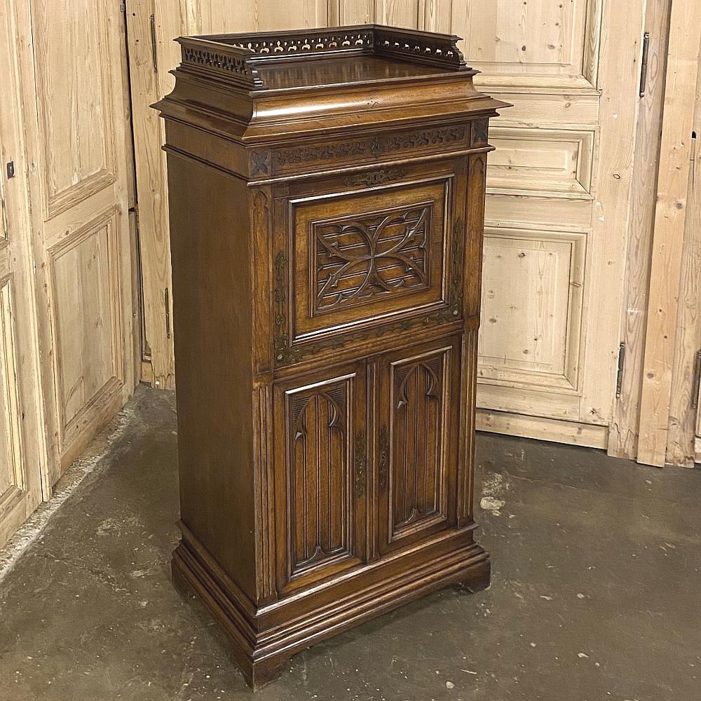19th century French Gothic walnut secretary ~ Cabinet is a superlative example of the mastery of furniture making during the middle to late 1800s in France! Designed as a compact all-in-one adjunct to one's office, it features a gallery rail with