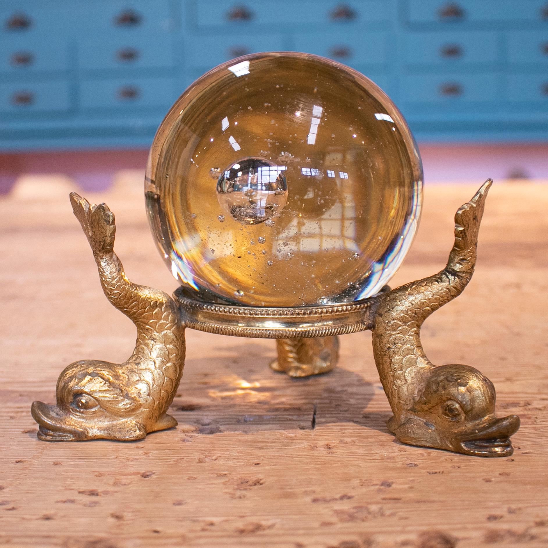 19th century French Grand Tour glass ball with bronze base sculpted with fish leg figures.