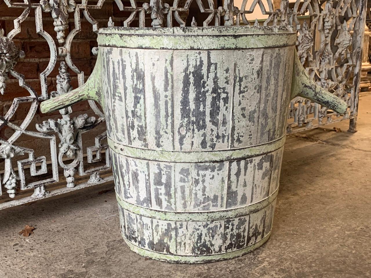 A nice Chestnut wood 19th century French grape harvesting hod. With beautiful original worn paint which gives it a good decorative look. It has its original iron bands and branch handles. 
This would make a wonderful log bin by the fire.