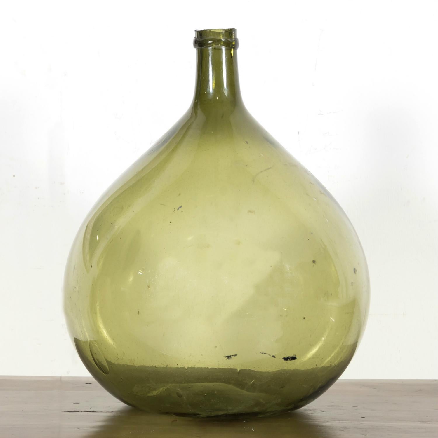 Blown Glass 19th Century French Green Glass Demijohn or Dame Jeanne Hand Blown Bottle For Sale