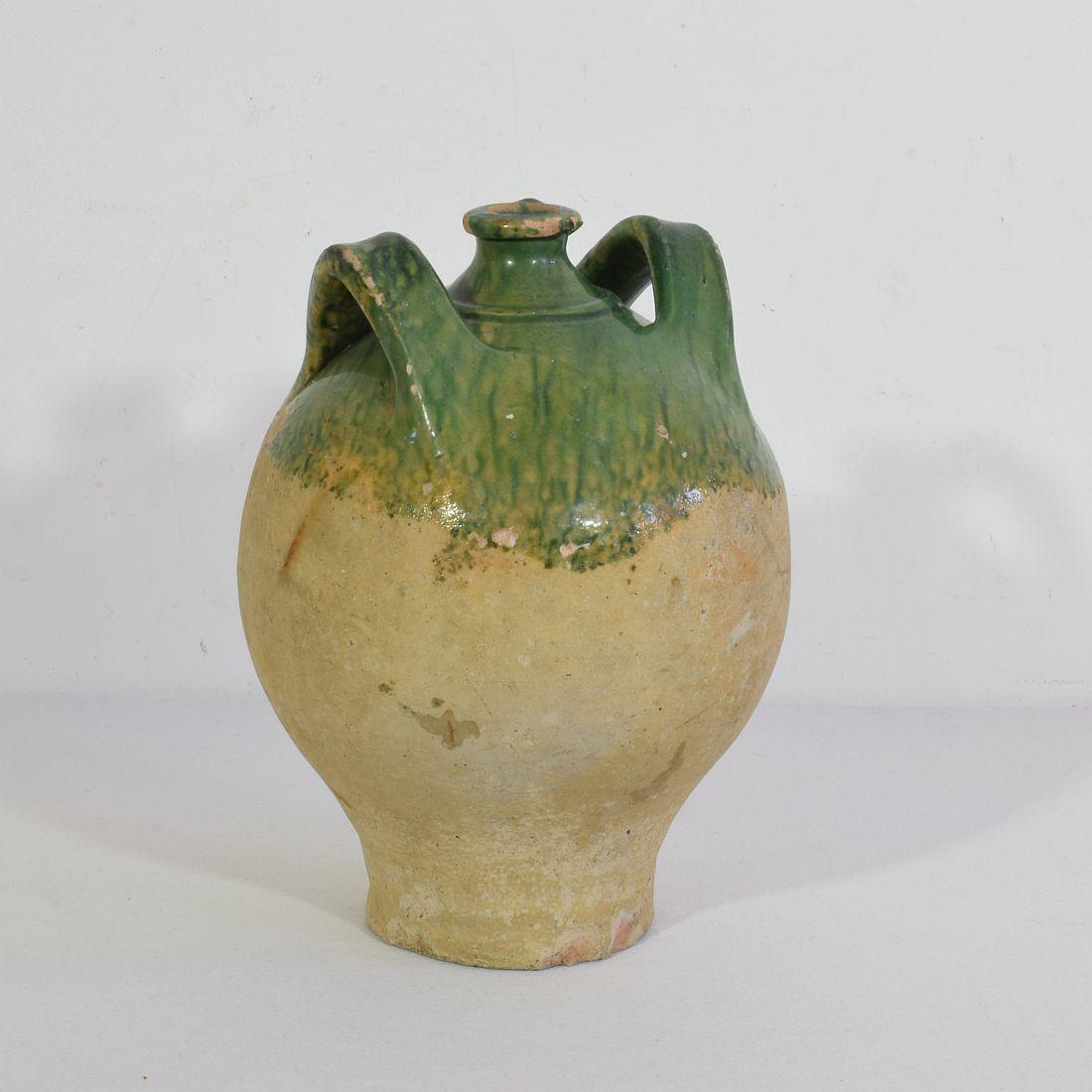 Great authentic and rare piece of pottery  from the Provence. Beautiful weathered and an amazing color. Imperfections help authenticate this water cruche as it was a utilitarian type piece, France, circa 1850.