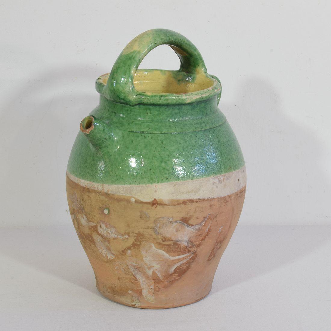 Great authentic piece of pottery from the Provence. Unique and rare glaze. Beautiful weathered. Chips and imperfections help authenticate this water cruche as it was a utilitarian type piece,
France, circa 1850-1900
Good condition.