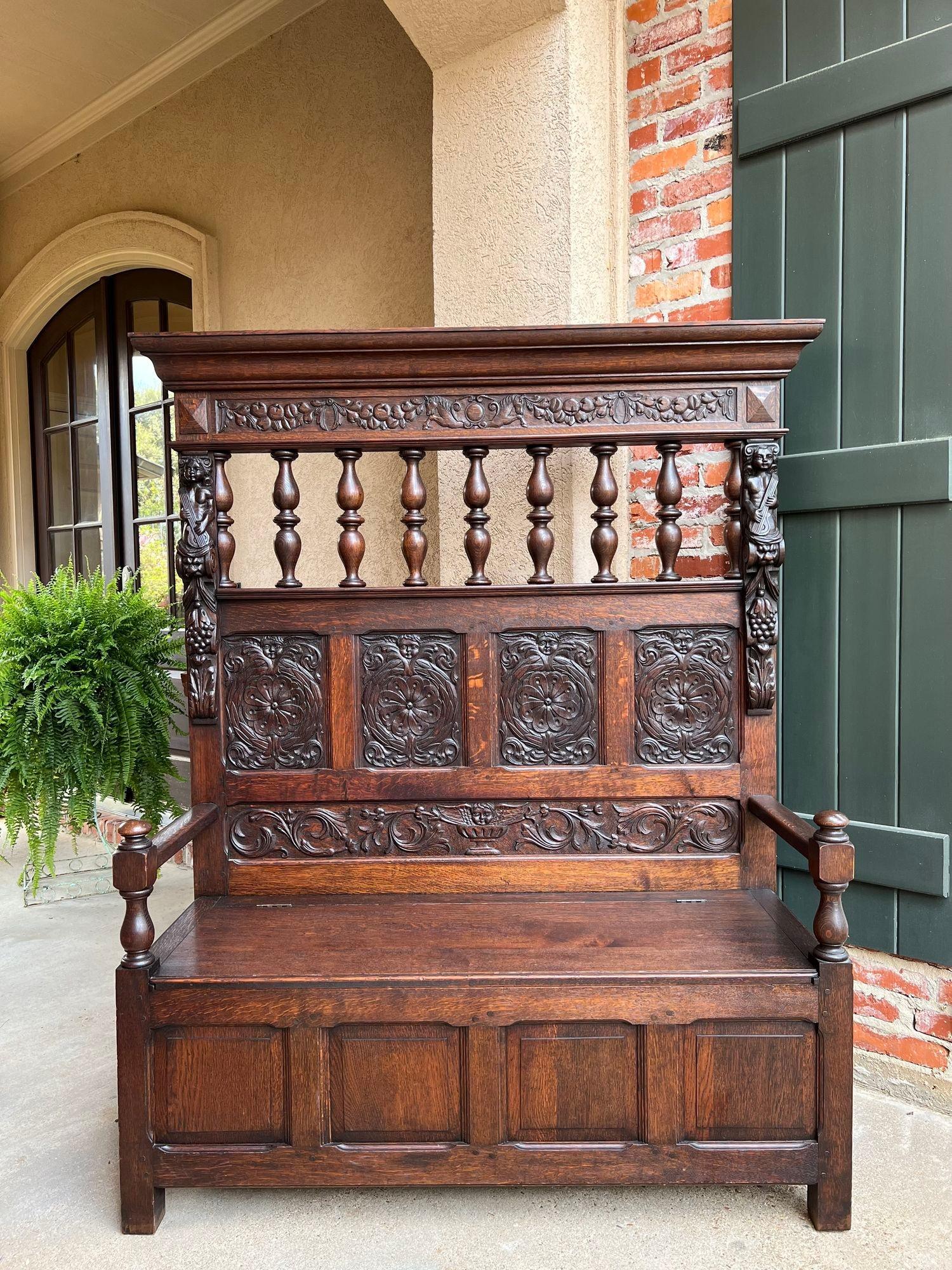 19th century French Hall Bench Settle Renaissance Carved Oak Cherub Black Forest.

Direct from France, a beautiful antique French hall bench, large enough for any home or castle!
The 5.5 ft. back features a large crown over a carved band of fruits