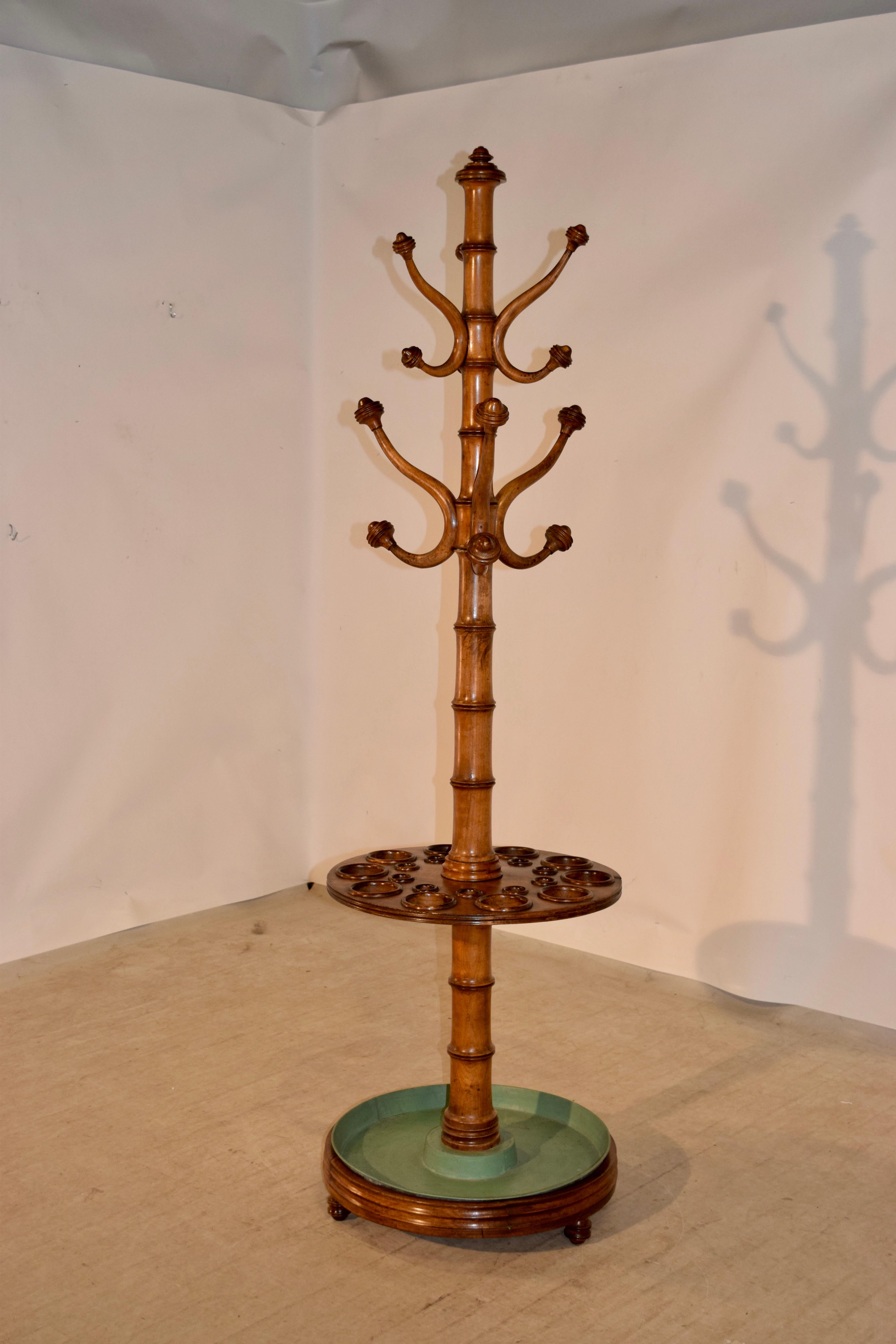 19th century French hall tree made from cherry and turned in the faux bamboo style of the Art Nouveau period. Wonderfully hand turned and original metal drip tray in base.