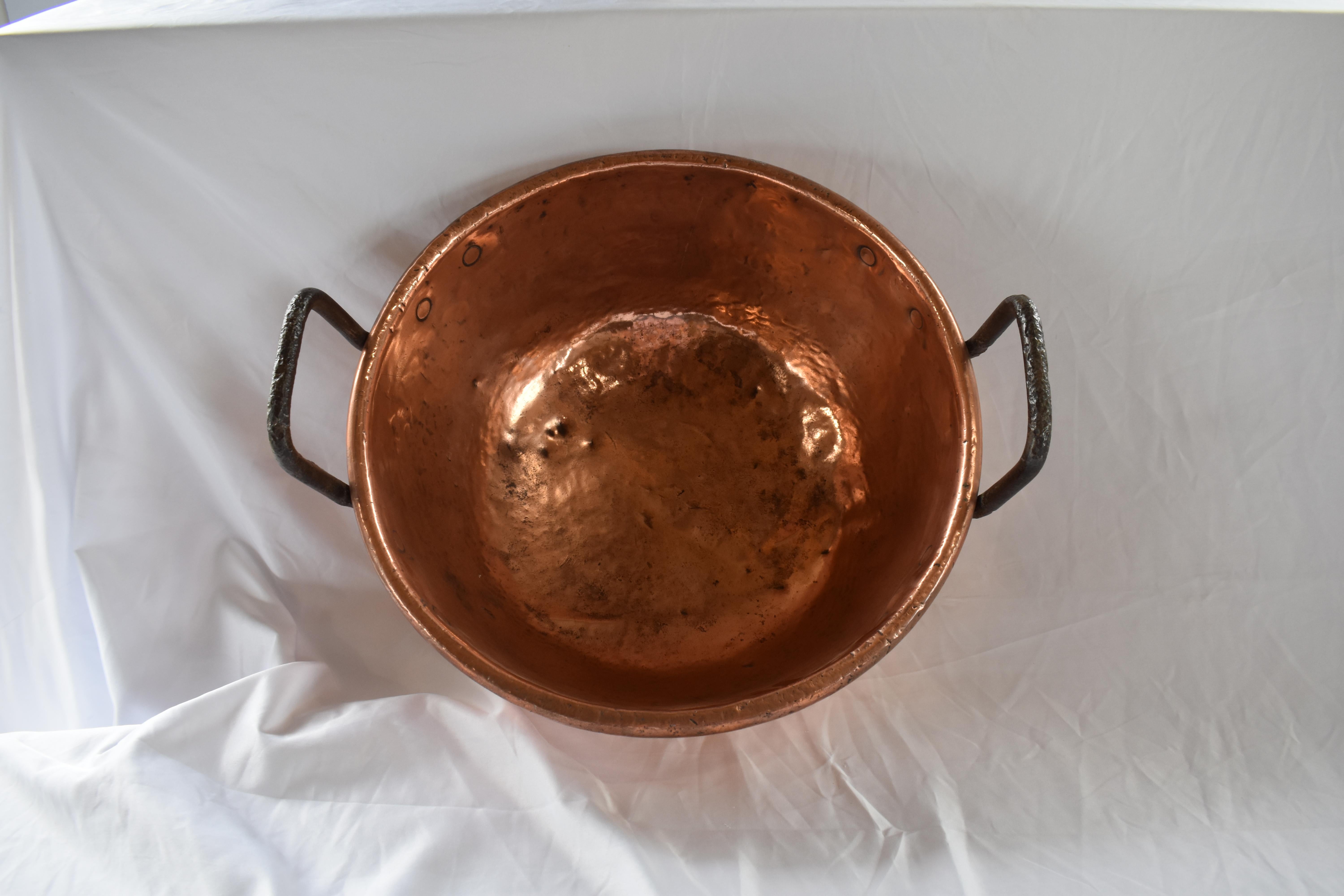 Copper candy kettle from France made towards the end of the 19th century, with beautiful finish. The kettle was made by hammering the copper into shape by hand. As shown in the pictures one can see the marks made by the tools. The handles were