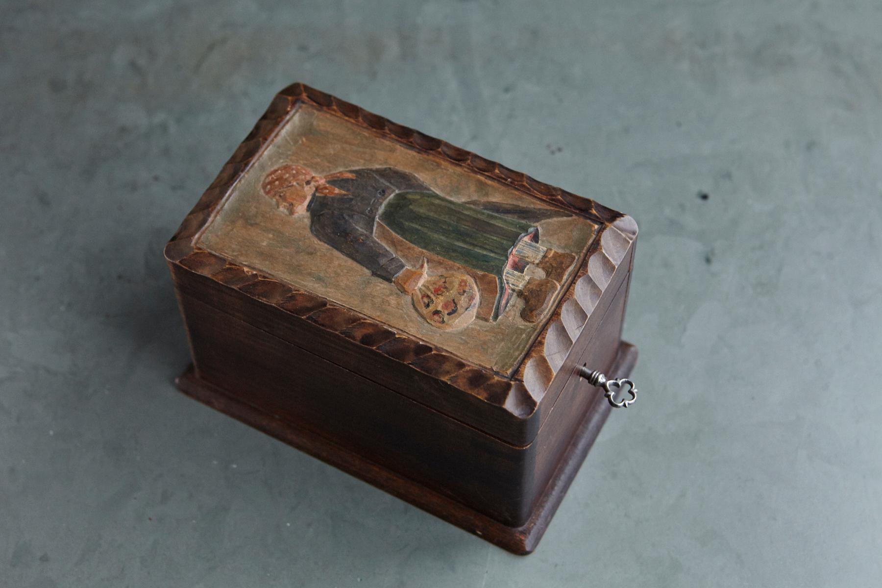 Lovely late 19th century French hand carved and hand painted wooden box with a hinged top depicting a farmer. The box has a functioning key.
 