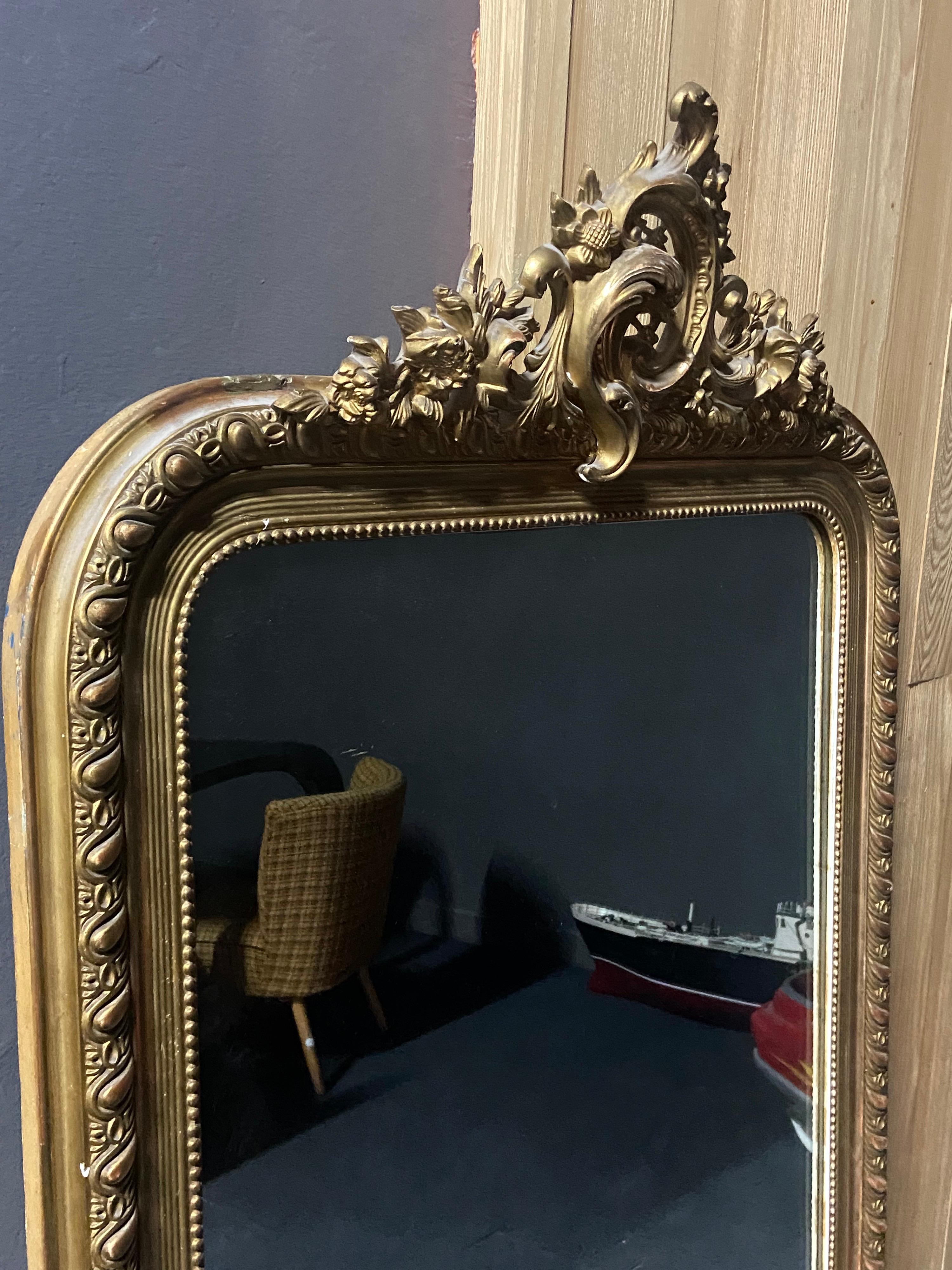 Large classic model of a giltwood hand carved mirror with original crystal glass in Louis VX style. Very good condition with very delicate small restorations done in the past.
France, circa 1880.