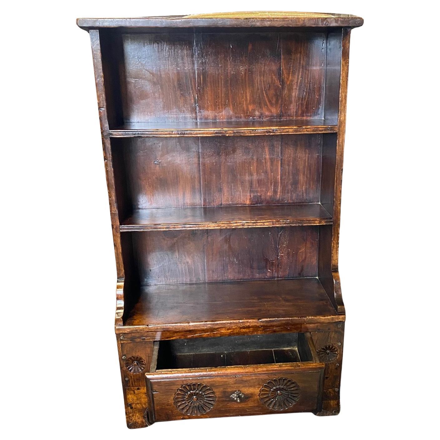 French walnut hand carved open bookcase with three shelves and a drawer in Louis XV style. Massive and stable in very good condition. Lovely carved sunflowers in base, which holds a large drawer and original pull. France, circa 1890. #7111
 H bottom