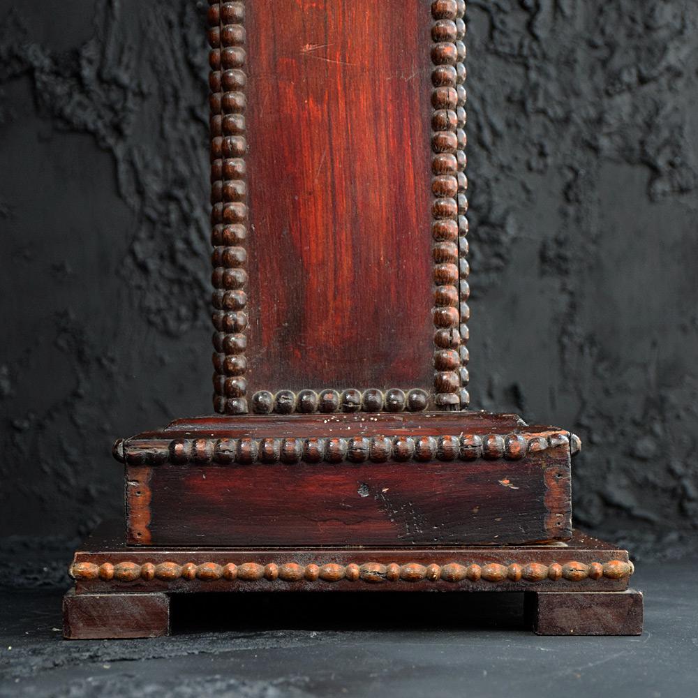 We are proud to offer an unusual example of a hand carved late 19th Century carved pedestal. This is a highly decorative and unusual example because of its hand carved studded detail which resembles brass studs. With natural aging and wear, this