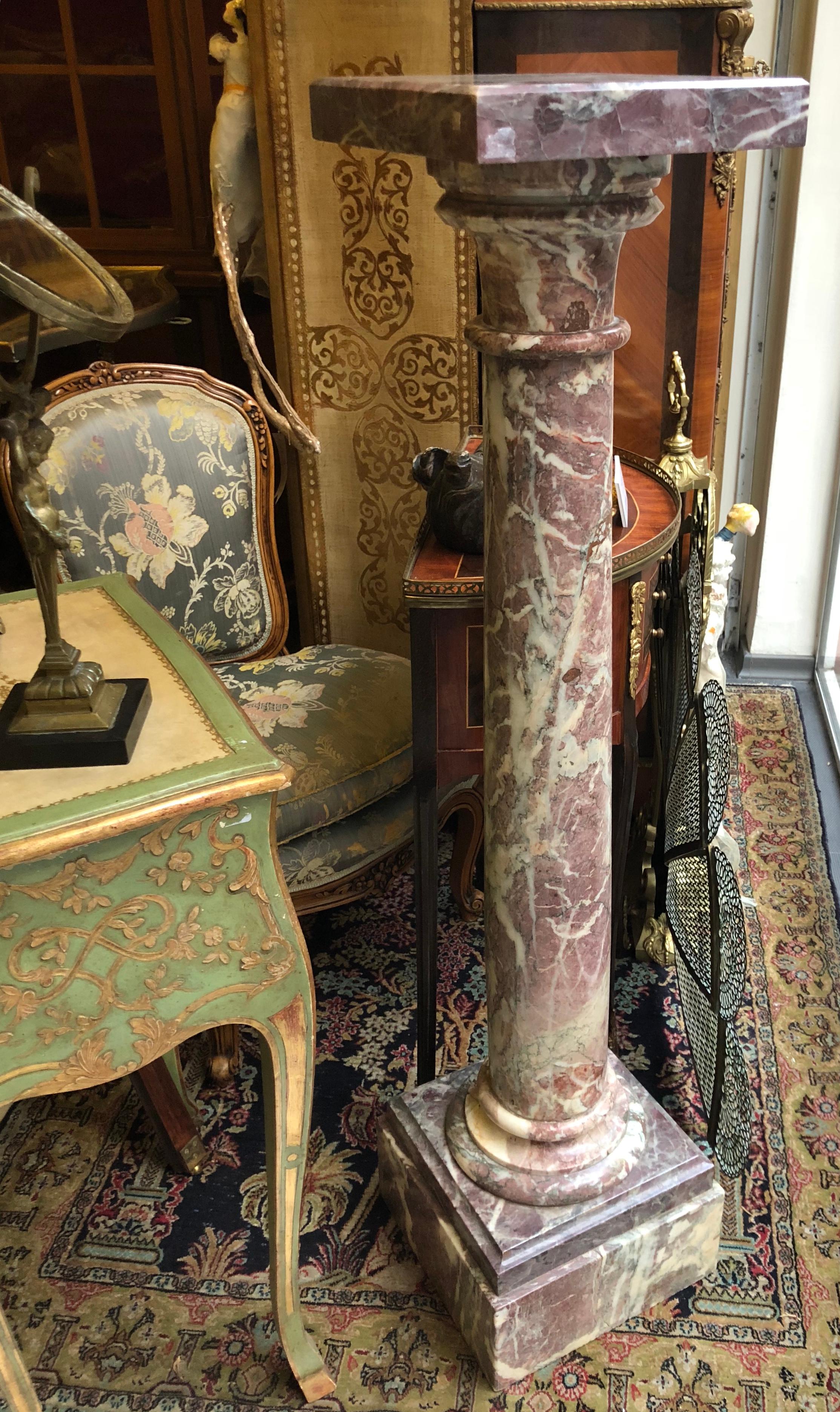 Hand carved marble column pedestal made of red marble with square head standing on a square, terraced base. 
Napoleon III style
France, circa 1880
