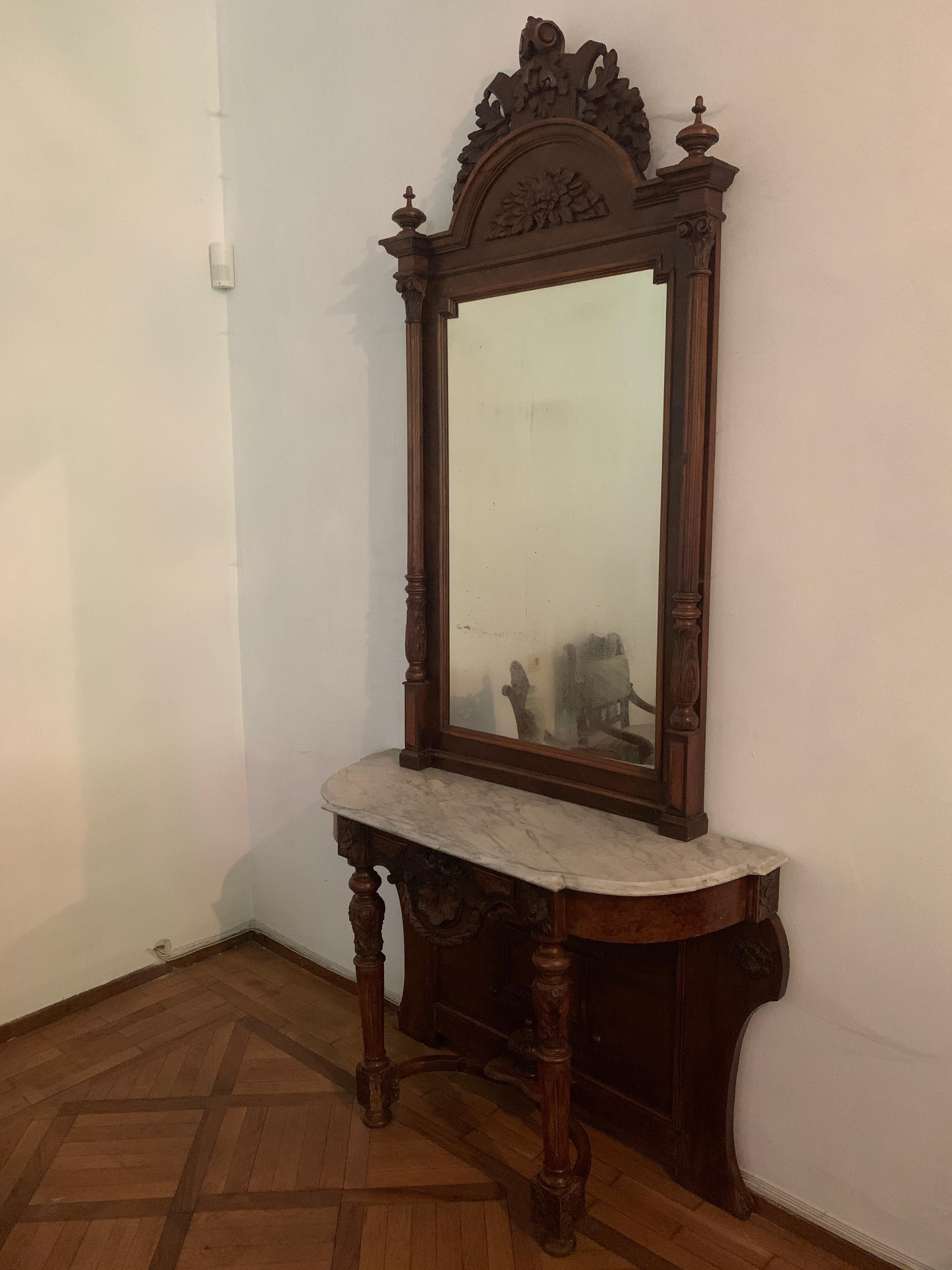 Grand hand carved walnut console with original mirror with fine carvings and marble top.
No restorations,
France, circa 1880.