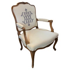 19th Century French Hand Carved Wooden Armchair with Linen Upholstery