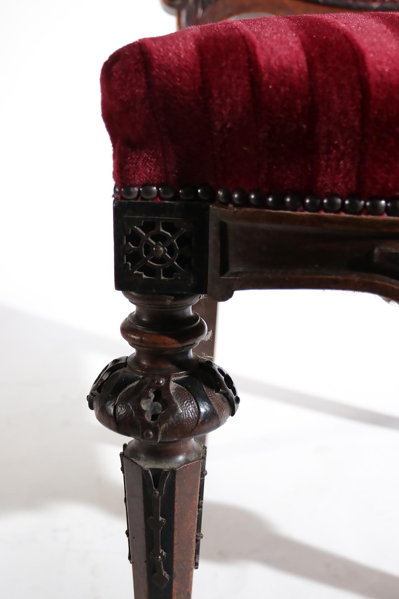 Beautiful chair made in France, circa 1860.
Special about the chair are the metal ornaments and the headline contains initials. 
The chair is fully new upholstered in red velvet.
 