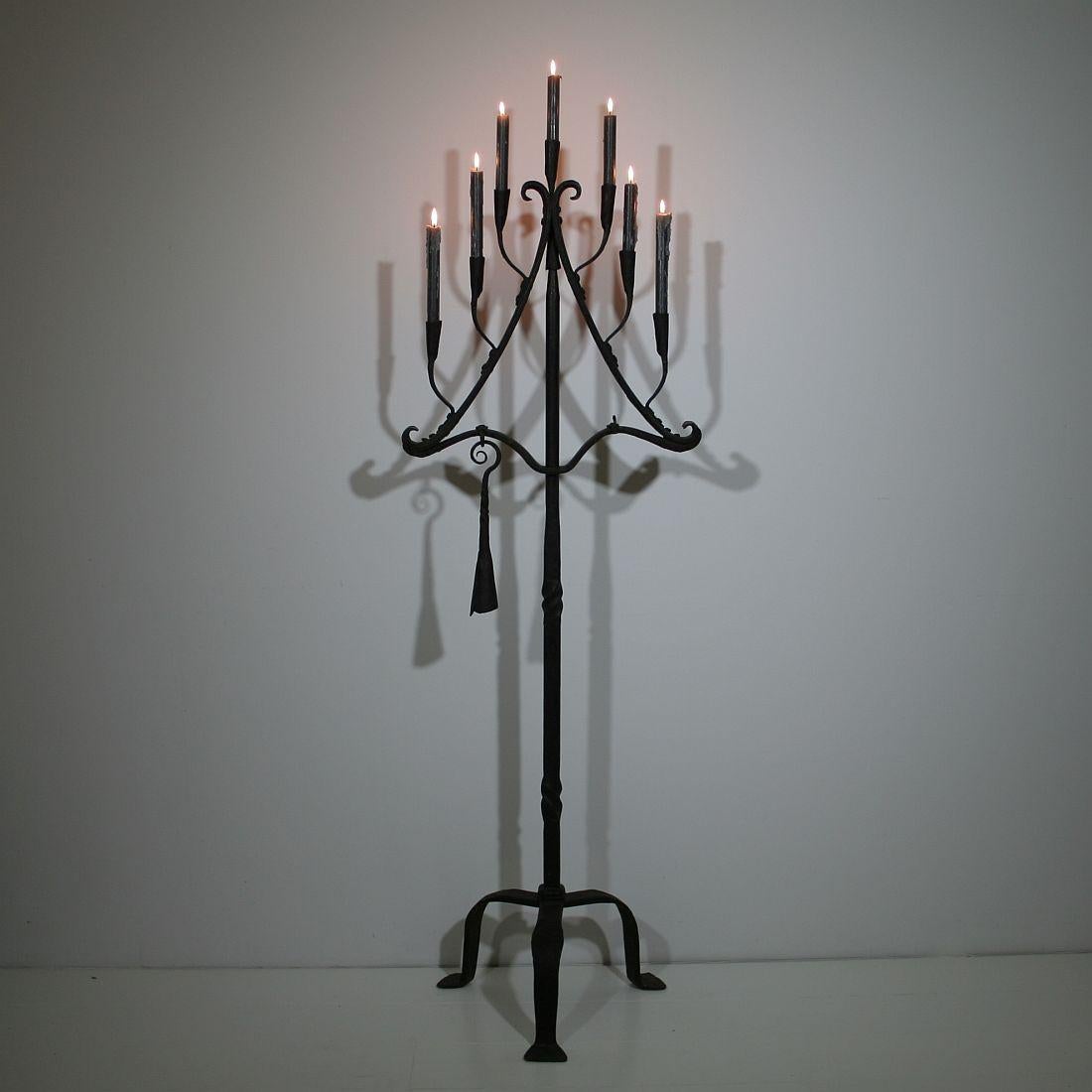 Spectacular hand-forged iron candleholder with its candlesnuffer.
France, circa 1850.
Good condition. Once converted into a lamp so one tiny hole visible.