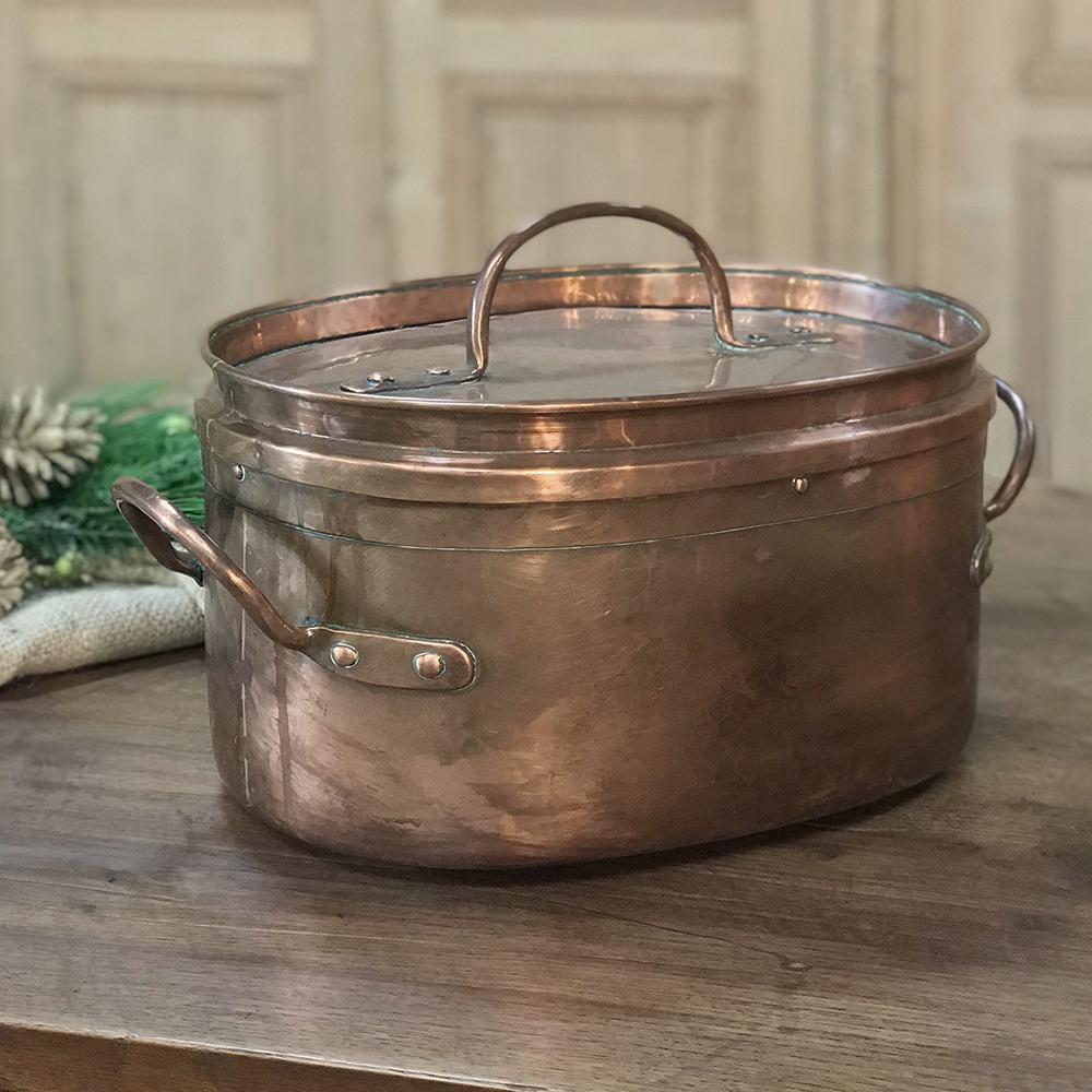 Handcrafted in 19th century France from solid copper with copper riveted handles, this 19th century copper roasting pot makes a great decorative item, as well as a rustic jardinière!
circa 1840s
Measures 13 H x 19 W x 11 D.
