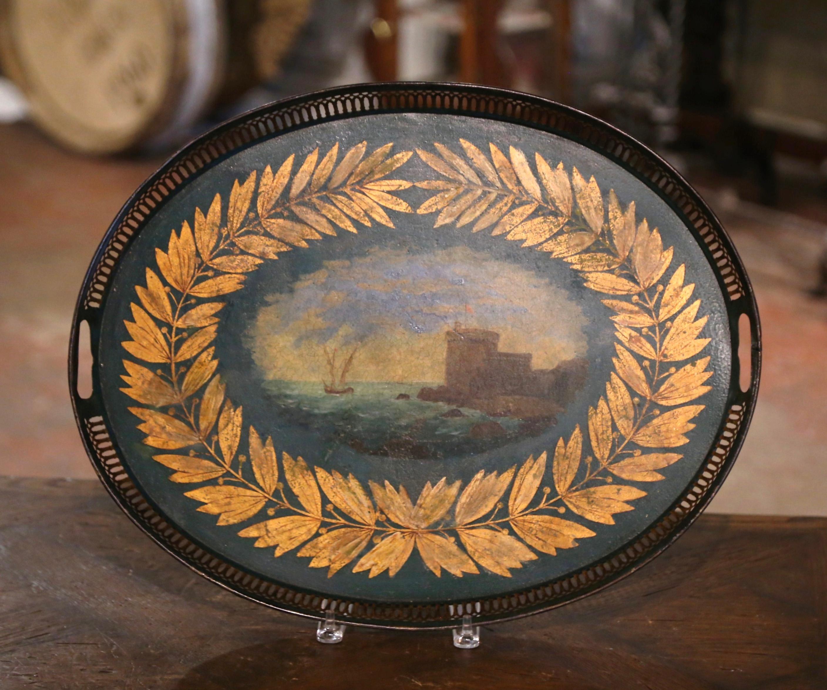 Decorate a coffee table with this elegant and beautiful antique tray. Crafted in France, circa 1870 and oval in shape, the colorful tray features side handles over a pierced gallery around the edges. The center medallion depicts an illustrated,