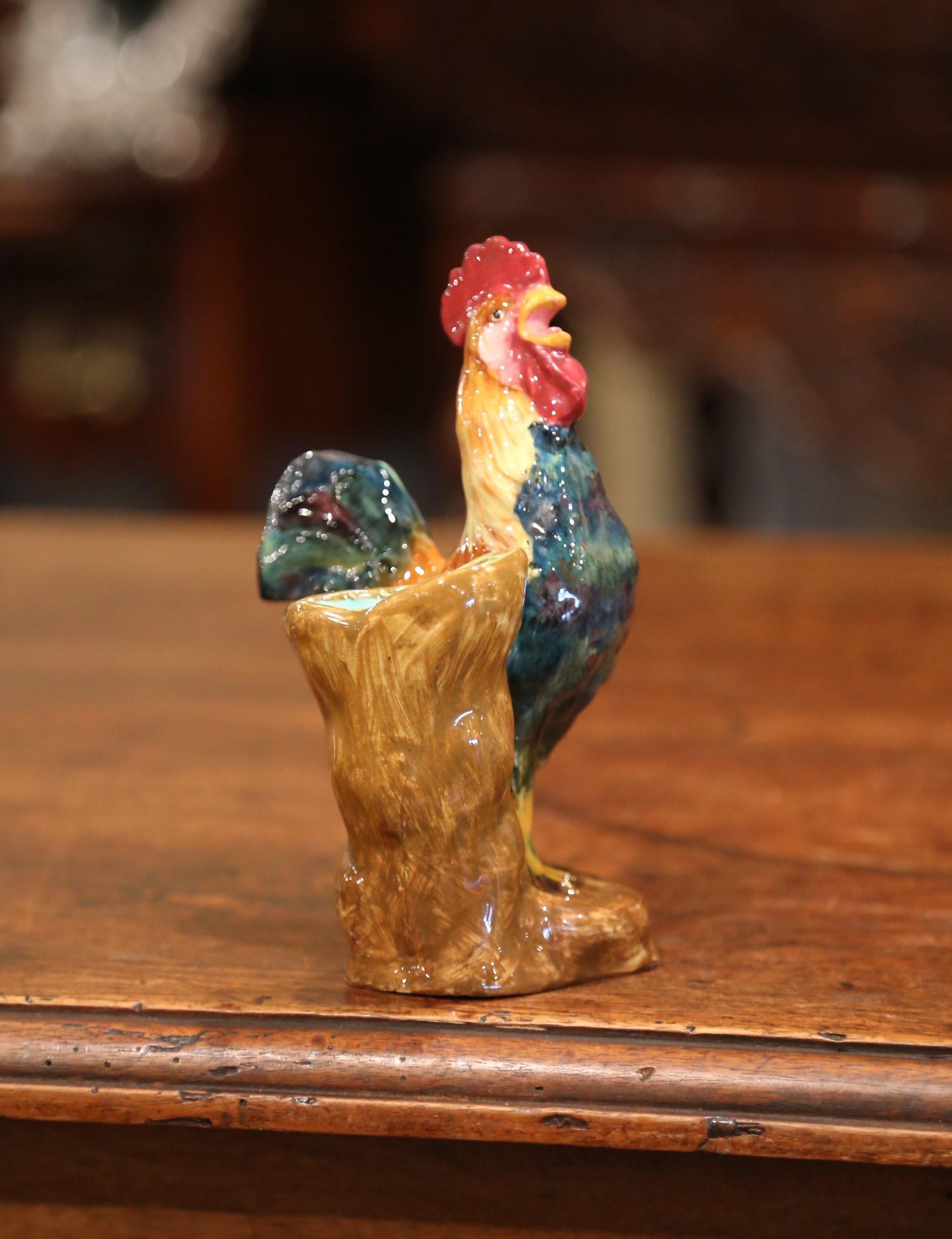 Bring the country French style into your home with this small, colorful, antique rooster figure. Crafted in France circa 1880, the chicken sculpture is a Classic French country home accessory. The porcelain animal is hand painted and signed on the