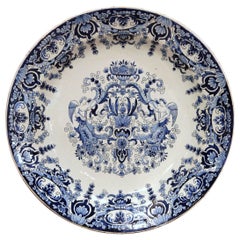 19th Century French Hand Painted Blue and White Faience Charger with Crest Motif 19th Century French Hand Painted Blue and White Faience Charger with Crest Motif