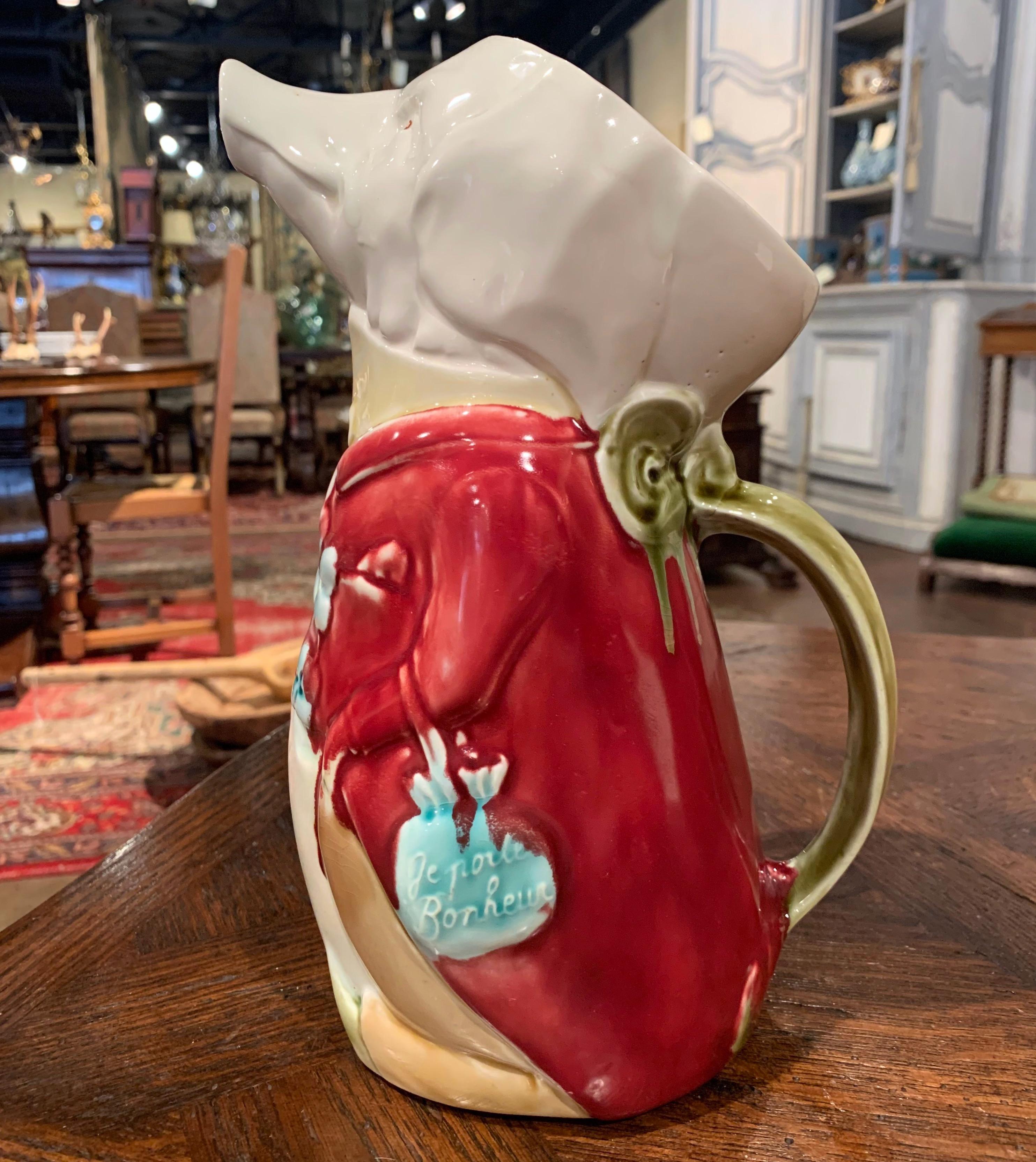 This colorful antique water pitcher was crafted in Northern France circa 1890, the pitcher, called 