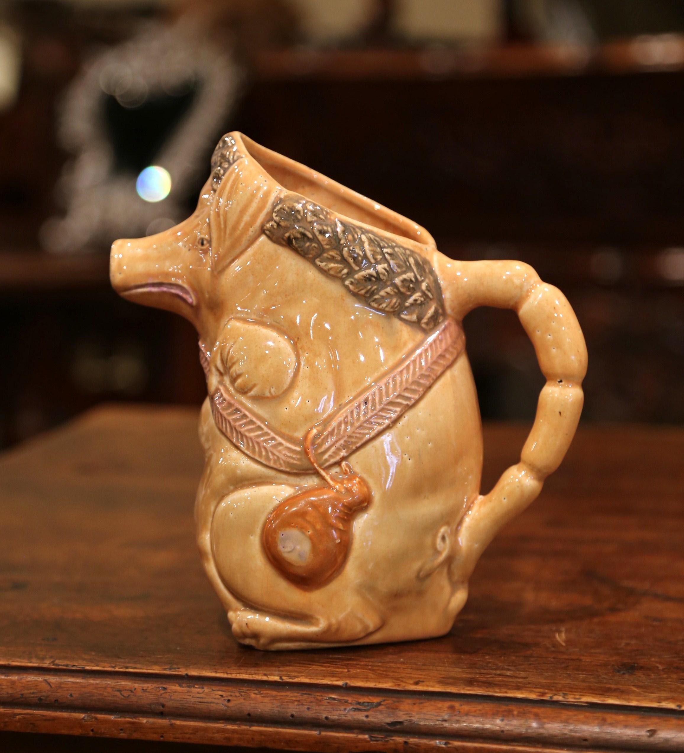 This colorful, antique water pitcher was crafted in Northern France, circa 1880. The jug, titled 
