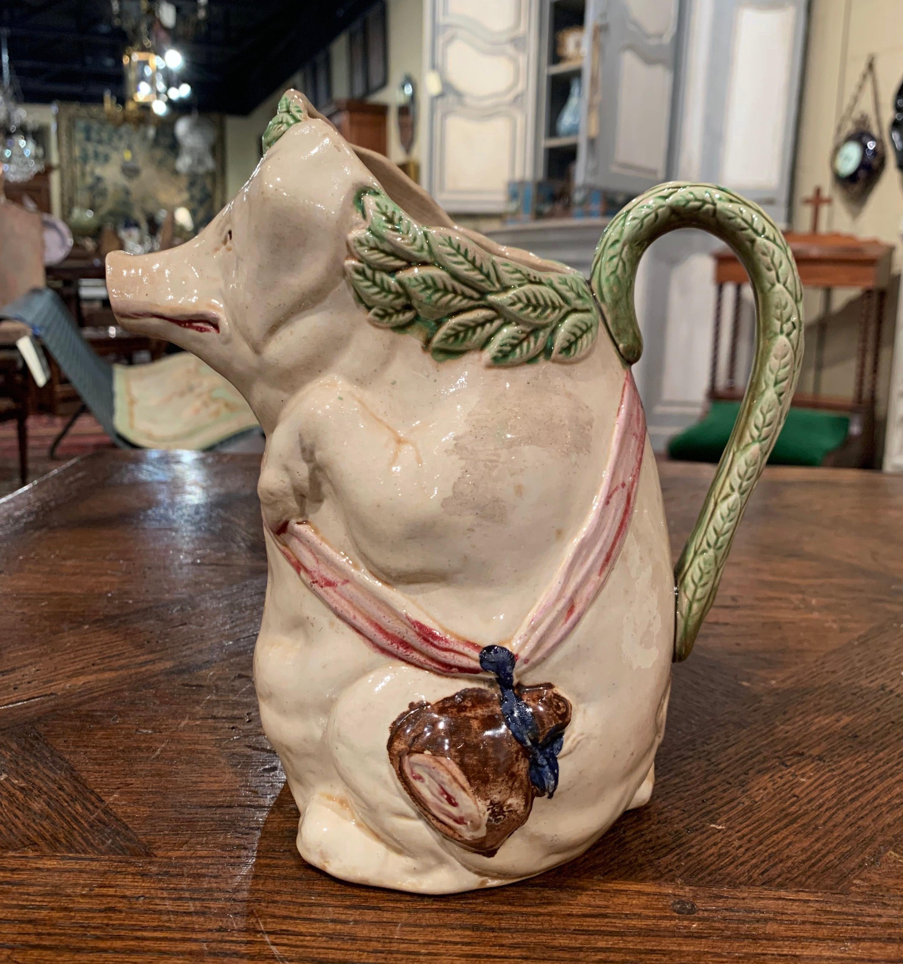 This colorful, antique water pitcher was crafted in Northern France, circa 1880. The jug, titled 