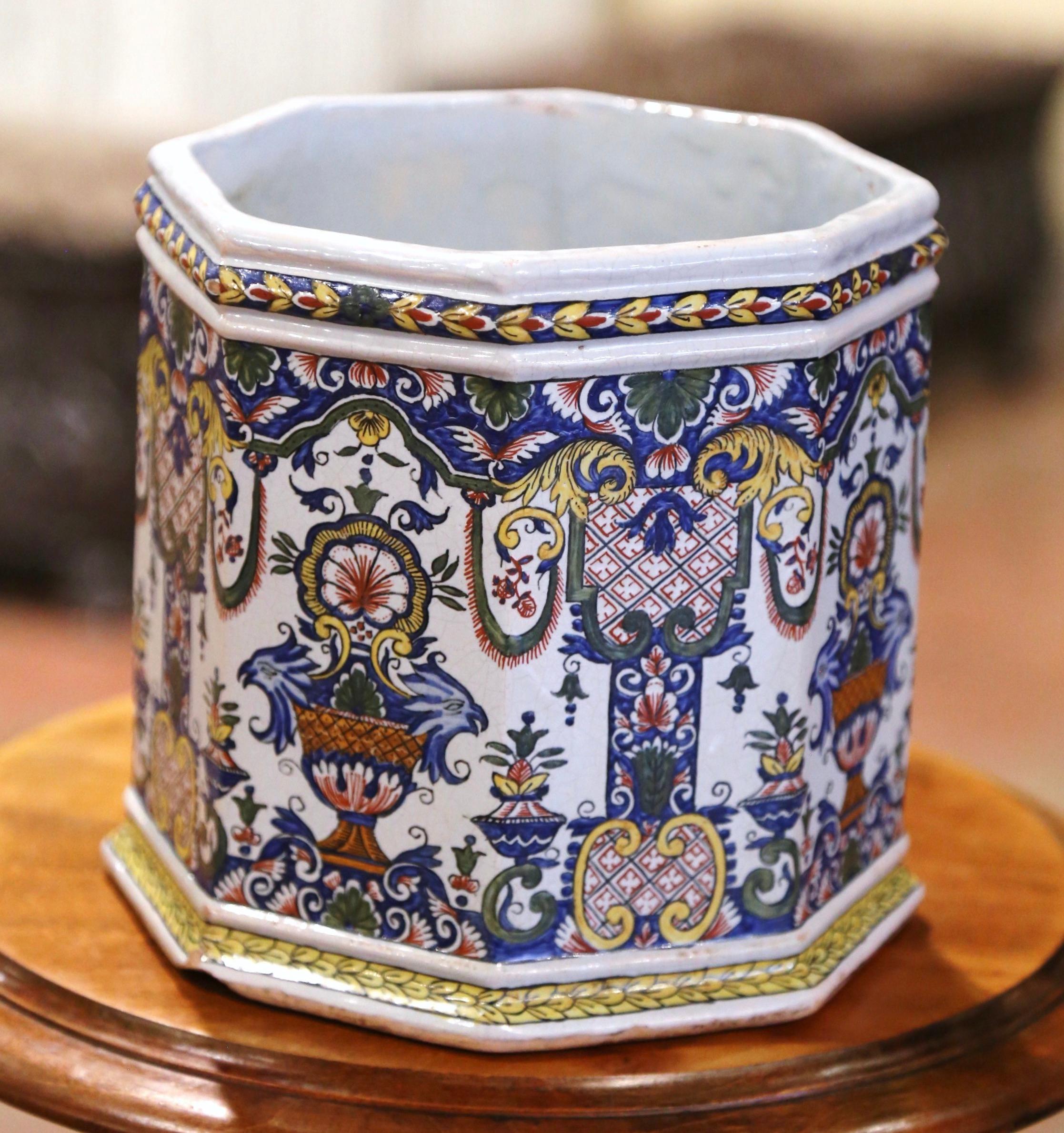 Decorate a mantle, table or buffet with this colorful antique planter. Sculpted in Normandy France circa 1880, and octagonal in shape, the ceramic jardiniere is decorated with hand painted motifs including the Normandy coat of arms, vasiform decor