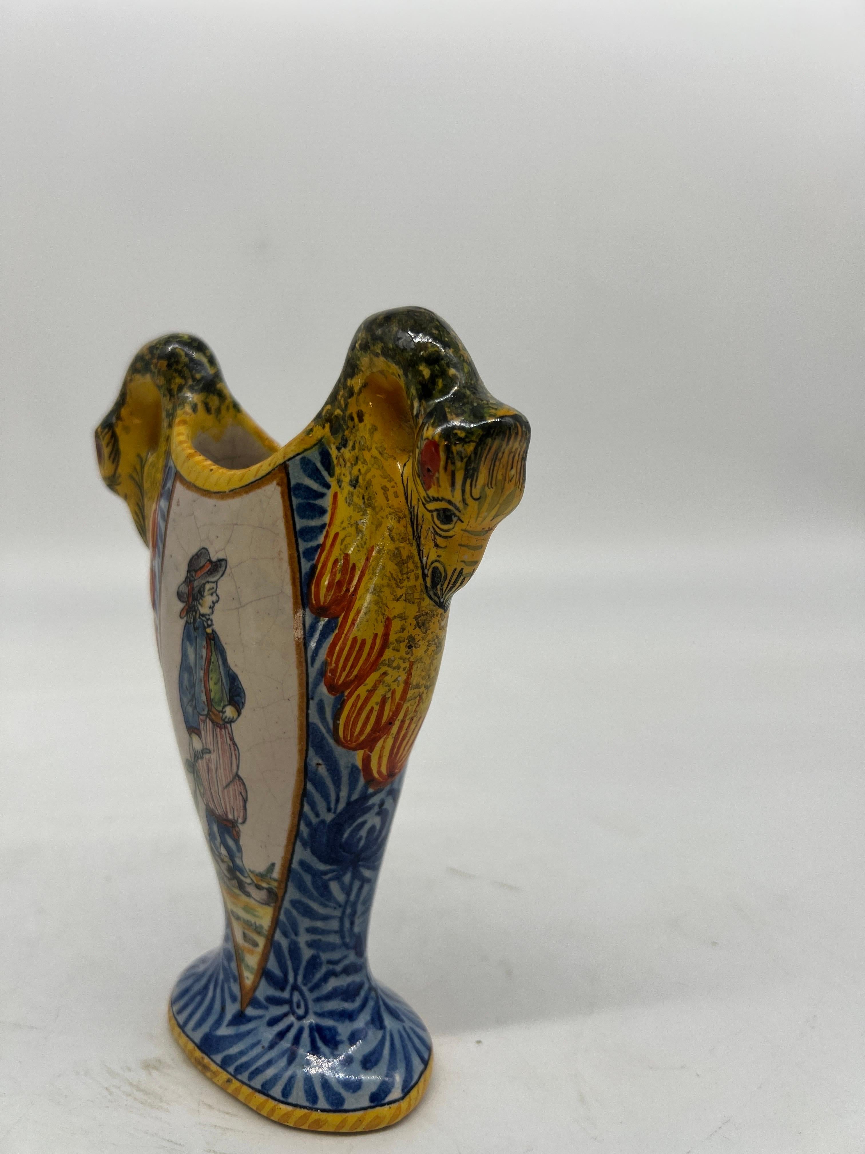The 19th Century French Hand Painted Faience Porquier-Beau Quimper Swan Vase is a remarkable piece of ceramic art. Made in Quimper, France, by the renowned Porquier-Beau pottery, this vase showcases the distinctive style and craftsmanship that the