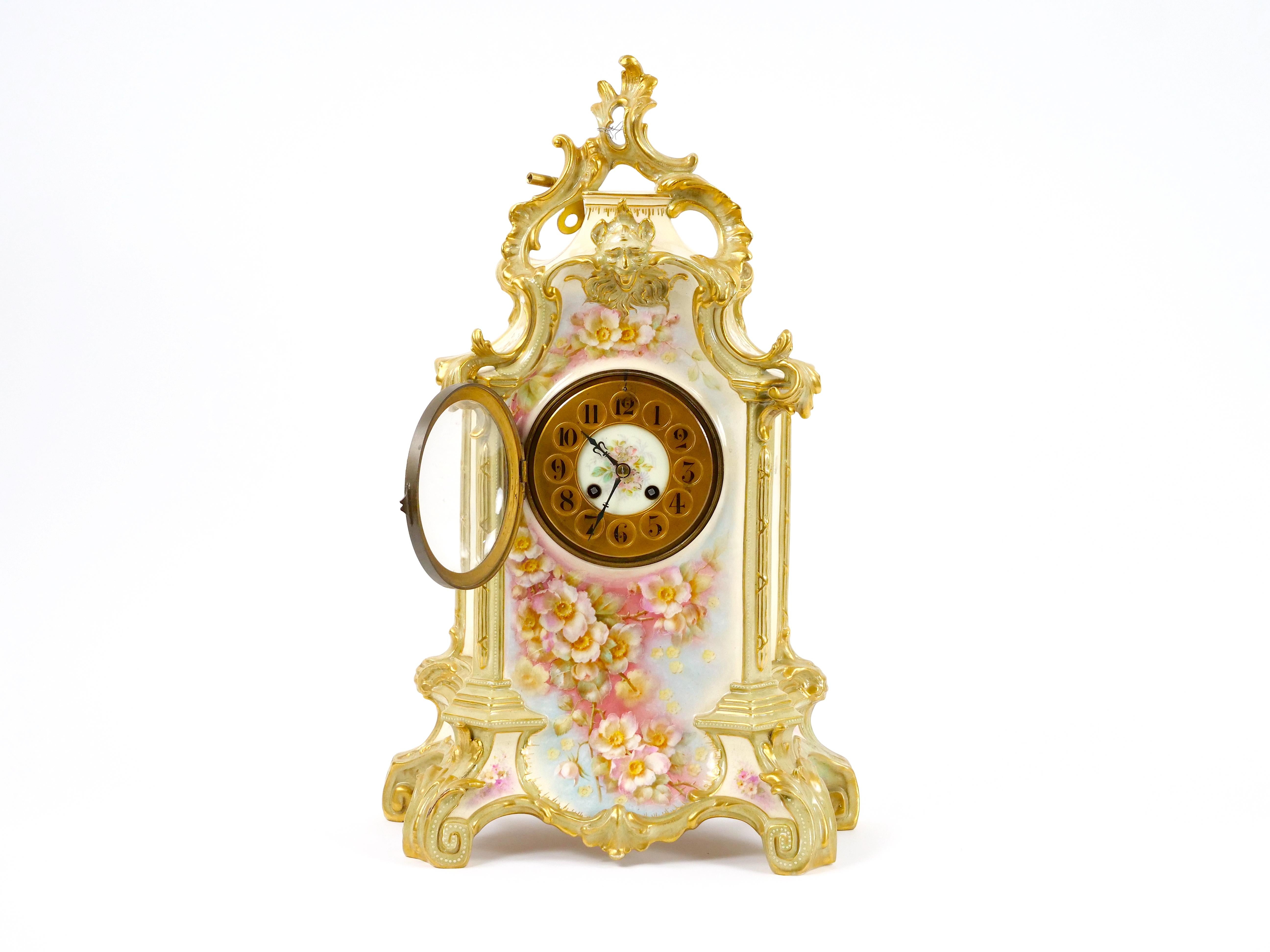 Elevate your decor with this exquisite 19th Century French Hand-Decorated and Gilt Gold Porcelain Mantel Clock, a true masterpiece of artistry and craftsmanship. This mantel clock is a fusion of function and aesthetic beauty, offering a glimpse into
