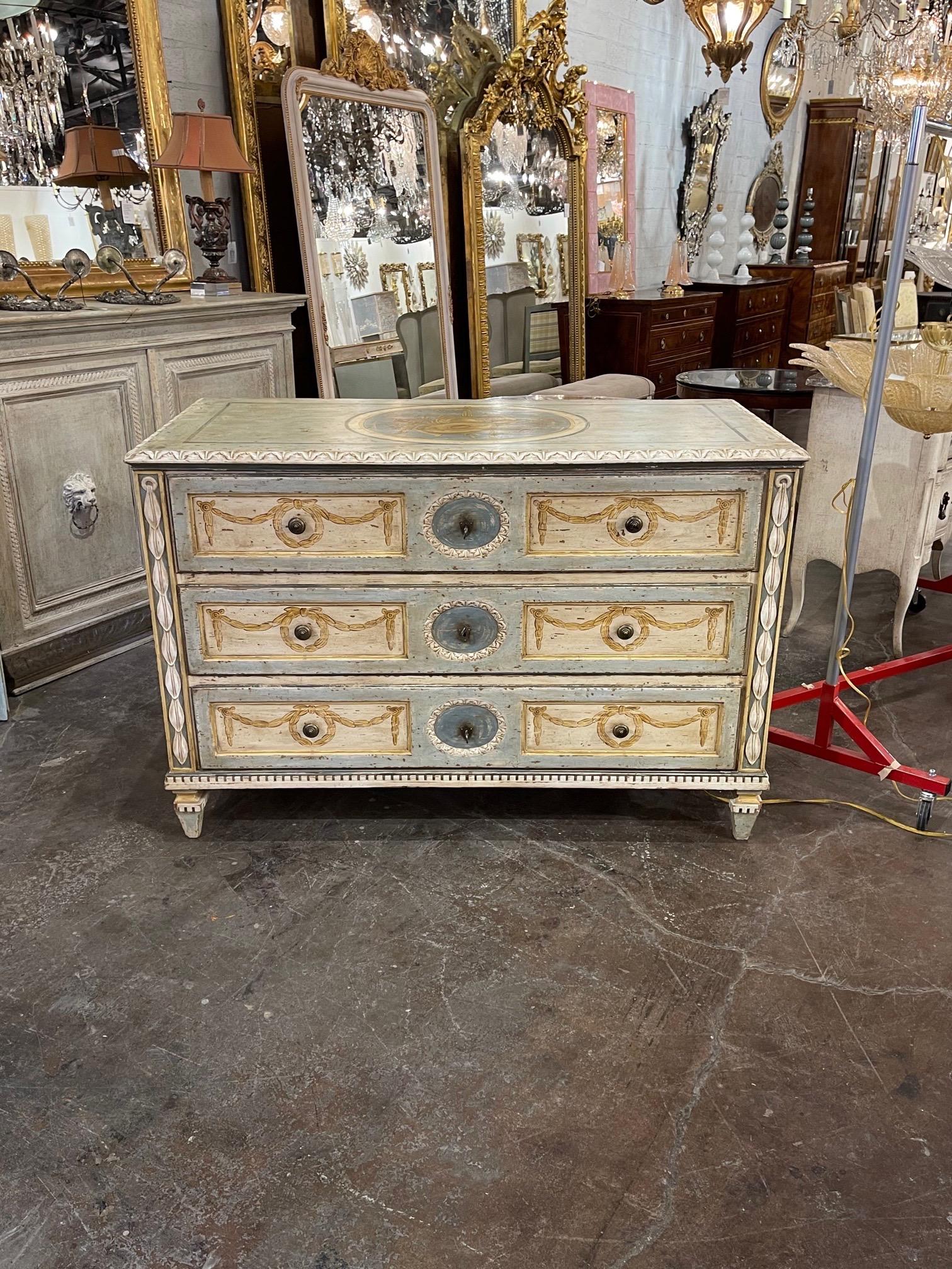 Decorative 19th century French carved and hand painted neoclassical style commodes. Pretty design in the colors of crème, blue/green and gold. Lovely!! Note: Price listed is per item.