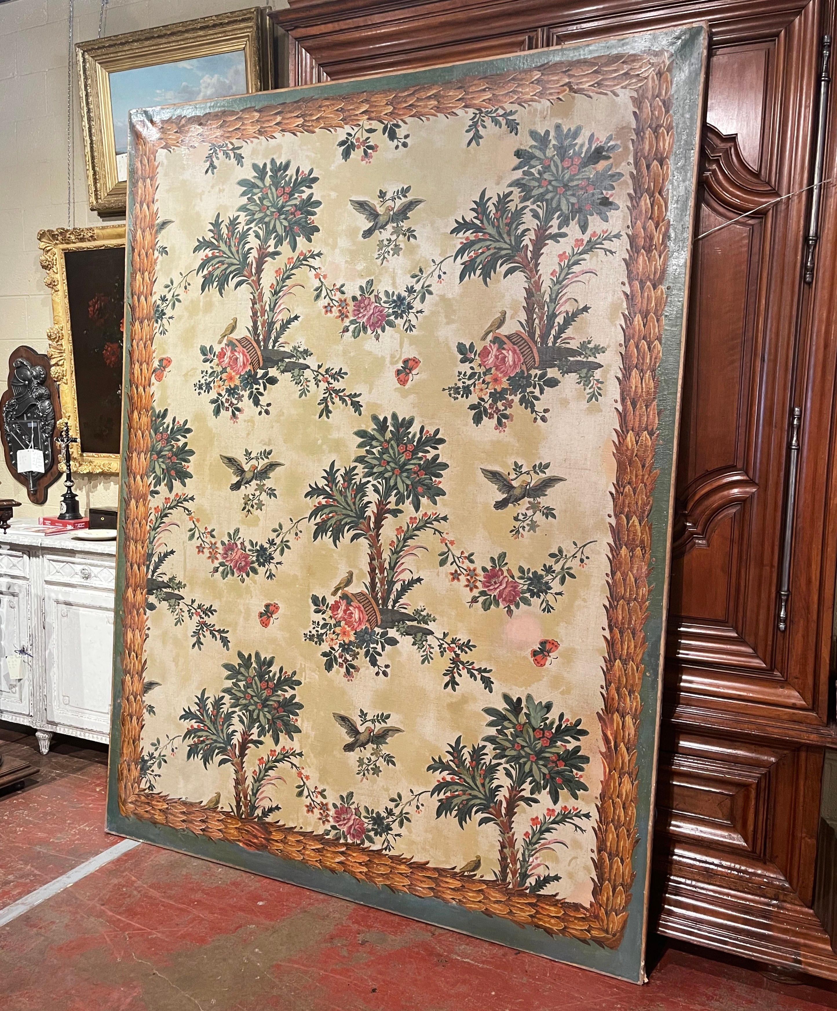 Decorate a whole wall with this important antique oil painting. Created in France circa 1870, the large canvas on stretcher features hand painted motifs including foliate, butterfly and bird and foliage decor throughout. The tall decorative painting
