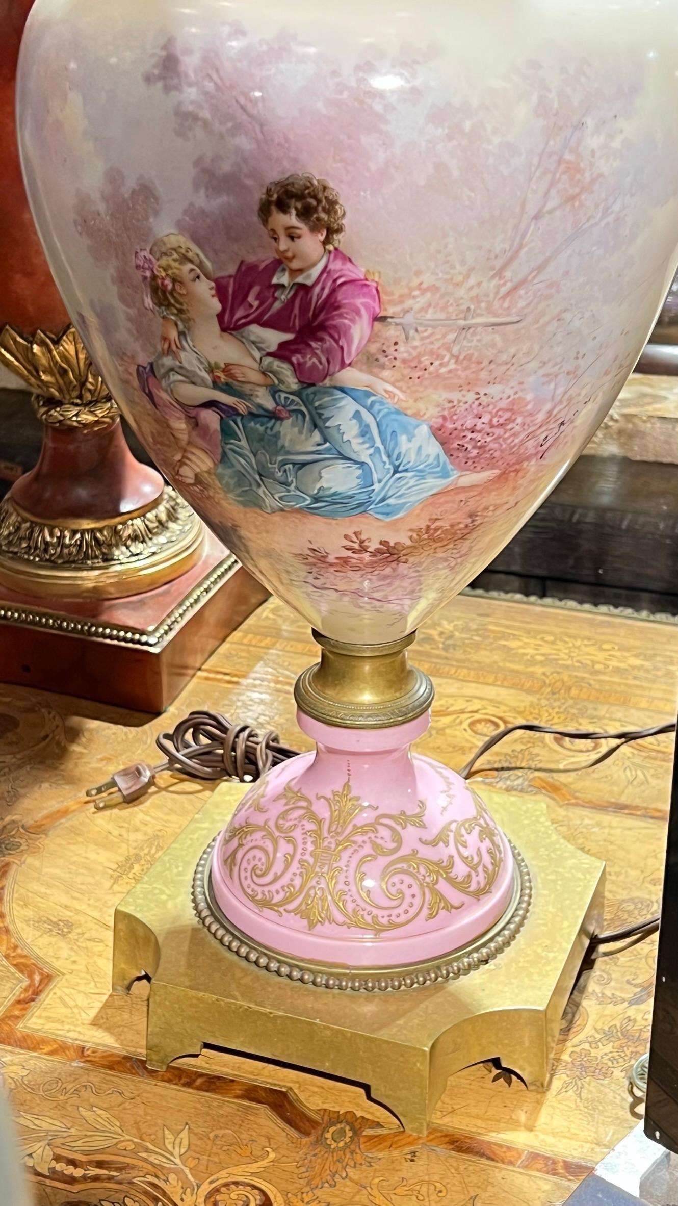 Antique (19th century) Sevres style urn-form porcelain lamp with finely painted scene of courting lovers in the Louis XV / XVI style.  Signed E Roy.
