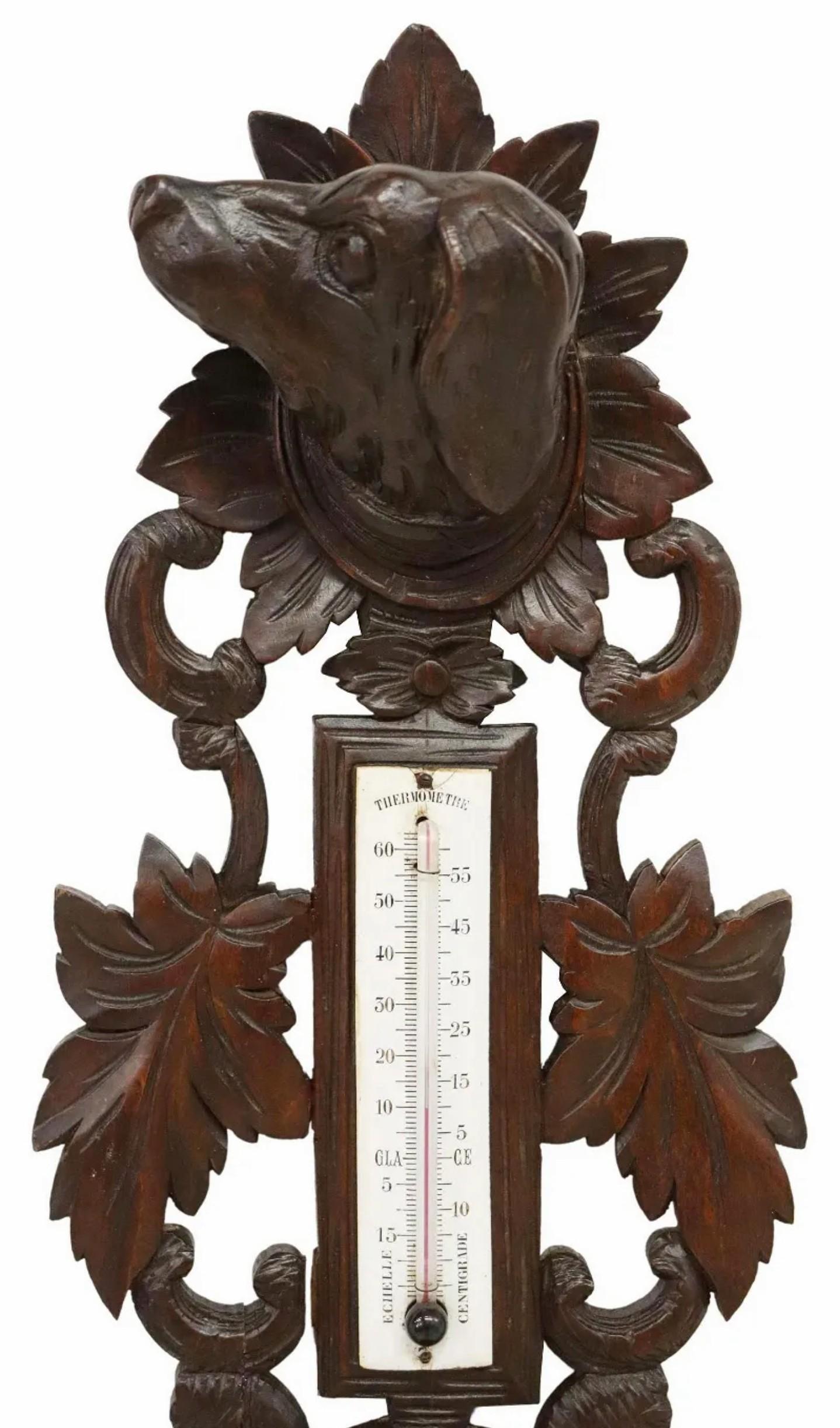 A large late 19th century French Henri II hunt style carved black forest oak wall-mounted barometer, exceptionally executed sculptural form, featuring a figural hound hunting dog crest over pheasant and hare game with foliate motif throughout,