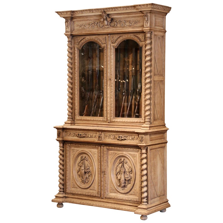 19th Century French Henri II Carved Light Oak Gun Cabinet with Hunt Motifs  For Sale at 1stDibs