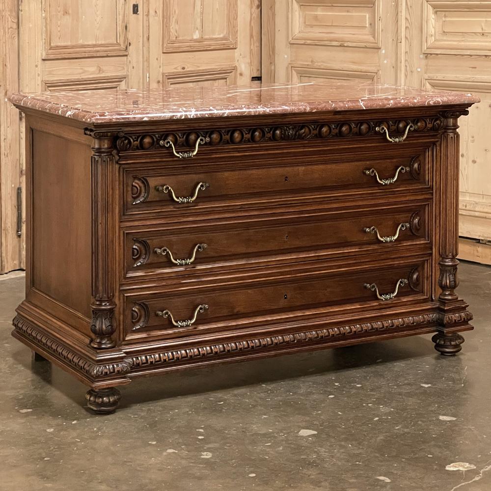 19th century French Henri II marble top walnut commode represents the impeccable melding of neoclassical architecture inspired by the ancient Greeks and Romans, with hand-carved embellishment inspired by the Renaissance around 1500AD. This example