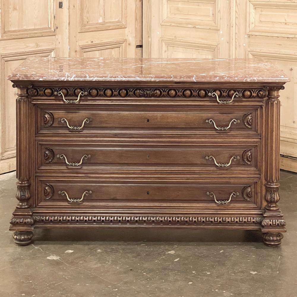 19th century French Henri II marble top walnut commode represents the impeccable melding of neoclassical architecture inspired by the ancient Greeks and Romans, with hand-carved embellishment inspired by the Renaissance around 1500AD. This example