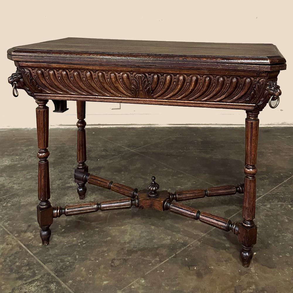 19th century French Henri II Neoclassical fliptop Game Table ~ Console represents a refined interpretation of the Renaissance style with boldly carved apron accented with full relief lions' heads on each corner with brass rings in their mouths. Note