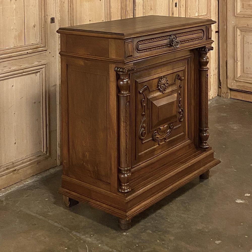 19th century French Henri II neoclassical walnut confiturier, cabinet is a stellar example of the petite buffet with one door affectionately called the confiturier because of its original design being intended to store confit jars in the kitchen. At