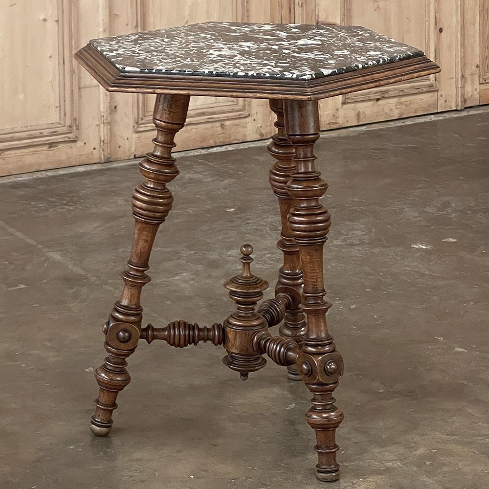 19th century French Henri II Walnut End Table with Hexagonal Marble Top is a remarkable result of traditional French craftsmanship melded with Industrial Revolution ingenuity! Skillfully using a lathe, the artisans turned amazingly intricate legs