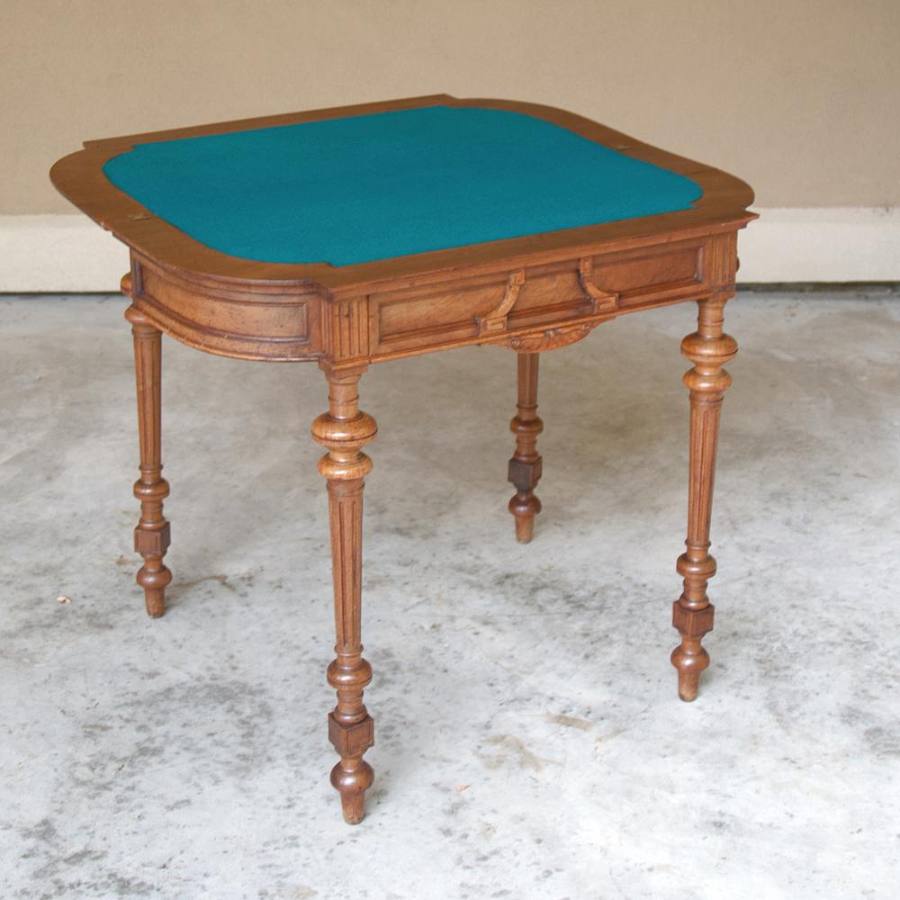 19th century French Henri II walnut game table, console is a remarkable expression of the cabinetmaker's art! Hand-crafted from sumptuous French walnut in the guise of a neoclassical console with four legs which makes it self-supporting, it was