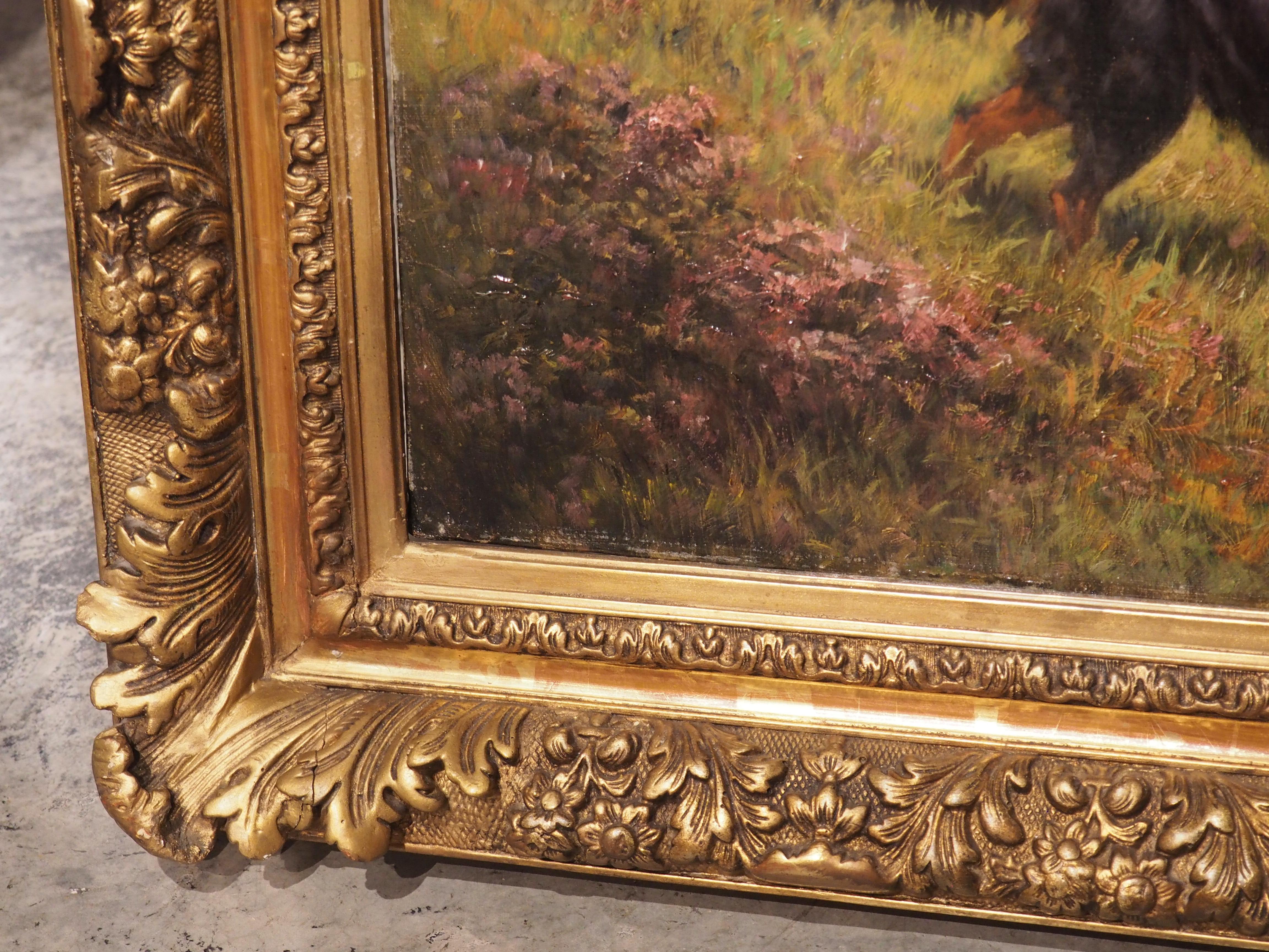 Surrounded by a floral and foliate giltwood frame, this antique French hunting dog painting exhibits a high level of artist skill, and it is a must-own for any dog lover. The canvas is signed in the lower right corner by the artist, “E Petit”.