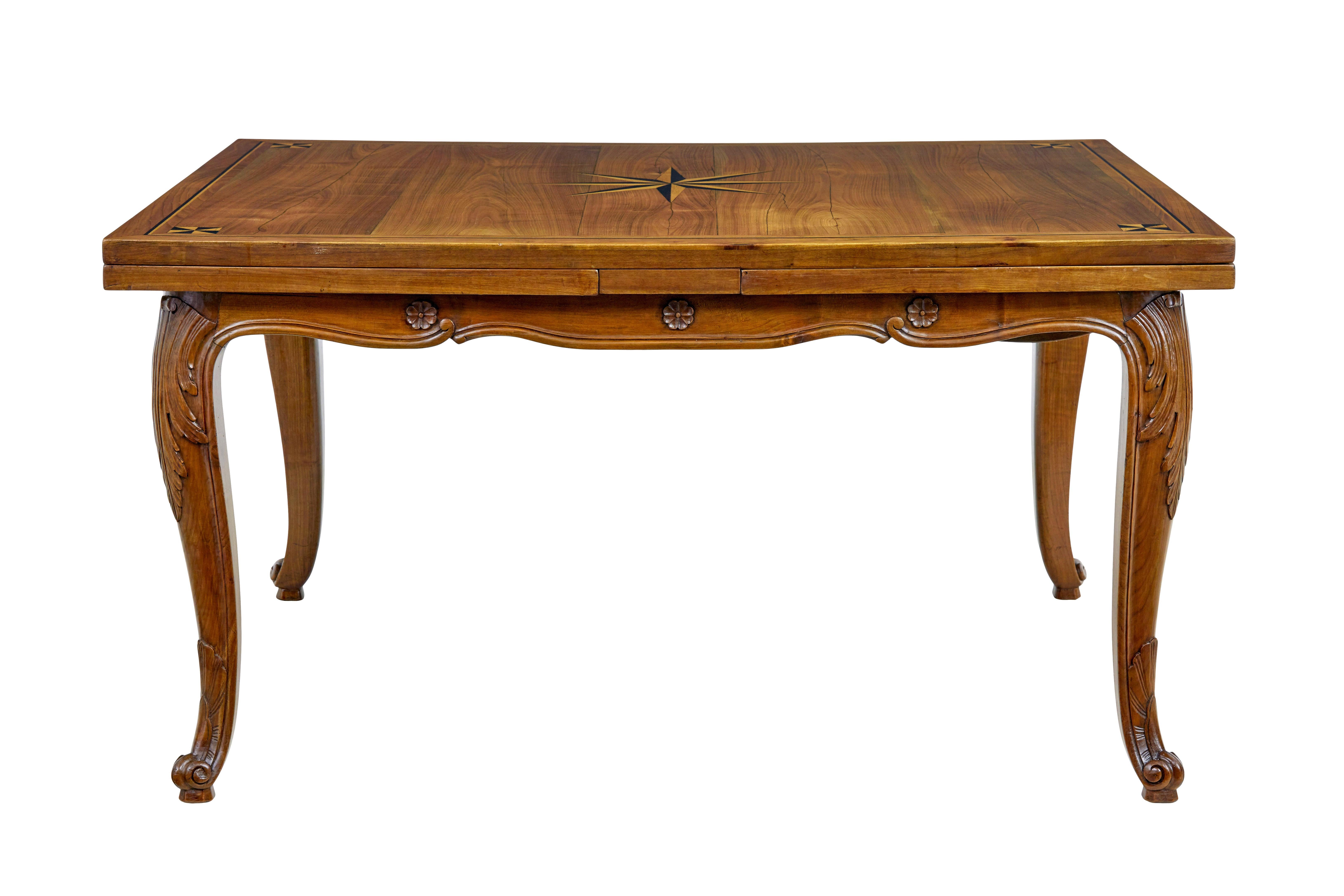 19th century French inlaid Fruitwood extending dining table circa 1880.

Fine quality french farmhouse draw leaf dining table.  Rectangular top with central inlaid star motif, complemented by further designs in each corner and border in the same