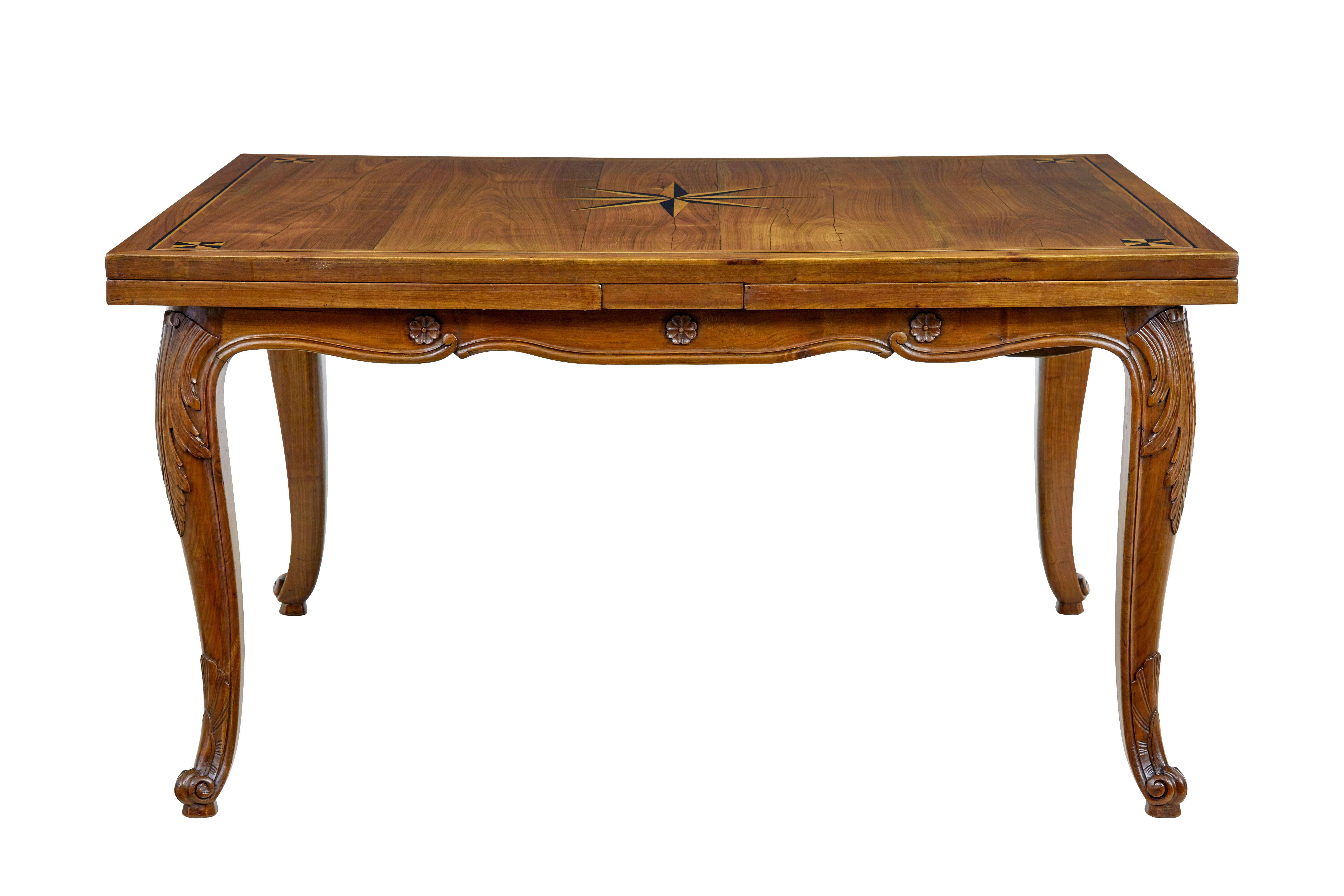 19th century french inlaid Fruitwood extending dining table circa 1880.

Fine quality french farmhouse draw leaf dining table.  Rectangular top with central inlaid star motif, complemented by further designs in each corner and border in the same