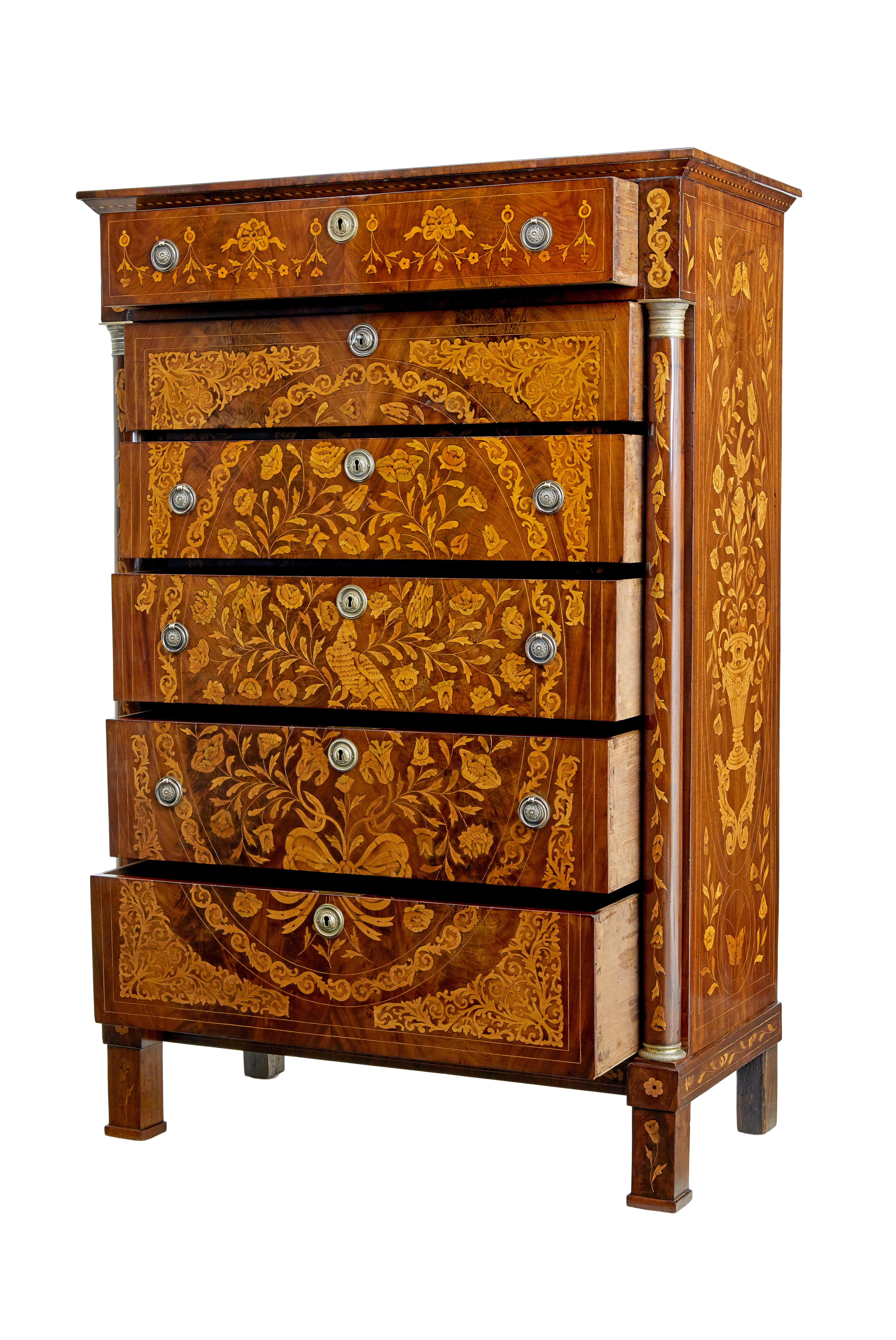 19th century french inlaid mahogany 6-drawer inlaid chest, circa 1830.

Early 19th century inlaid french mahogany 6-drawer chest with inlaid turned columns. Profusely inlaid on all surfaces with foliage, birds and butterflies. Later handles, as this